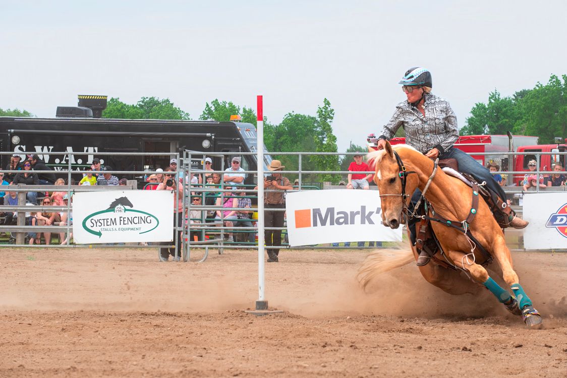 Dynamic Rodeo Barrel Racing Action Shot · Free Stock Photo