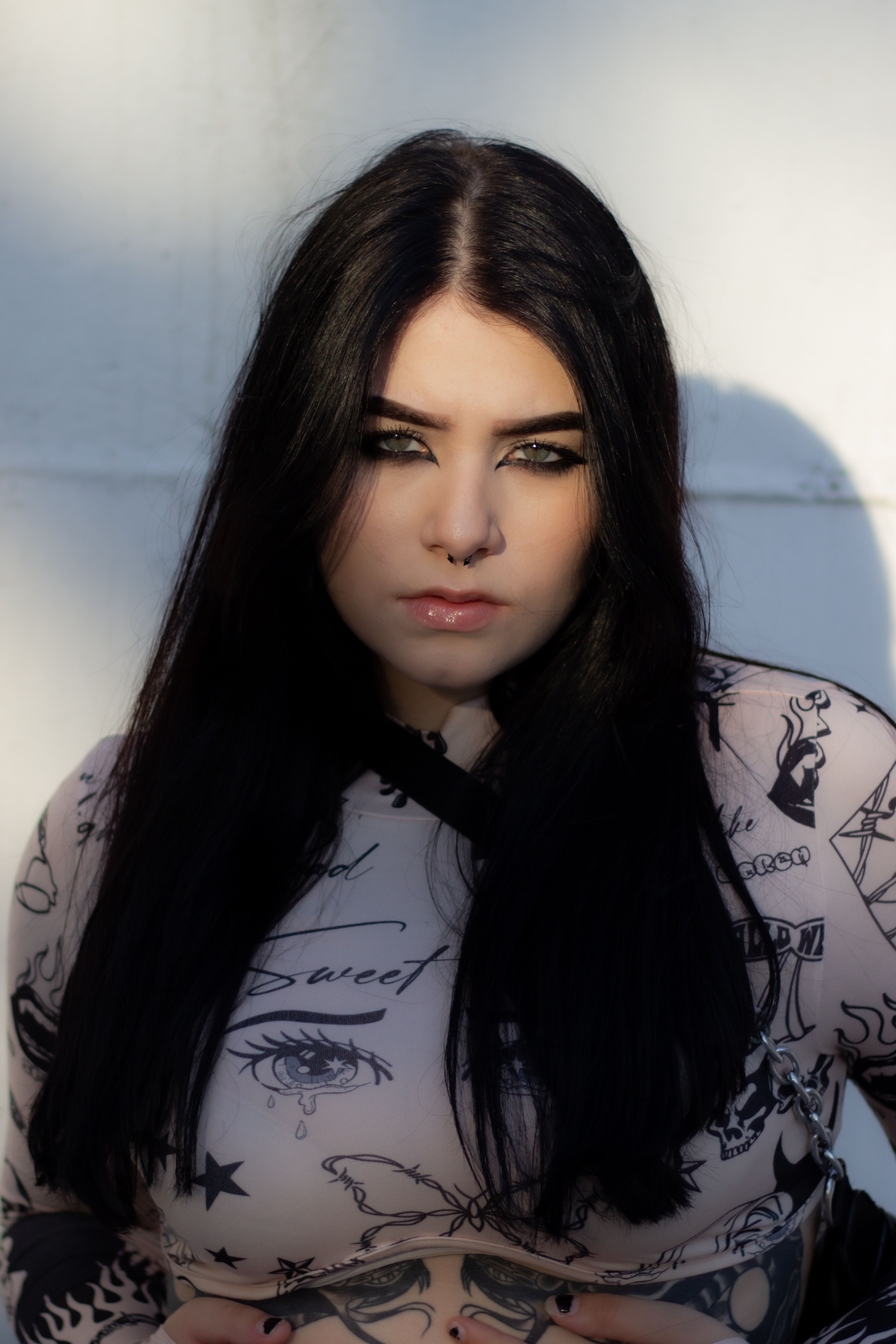 Black-haired woman in tattoo print clothes