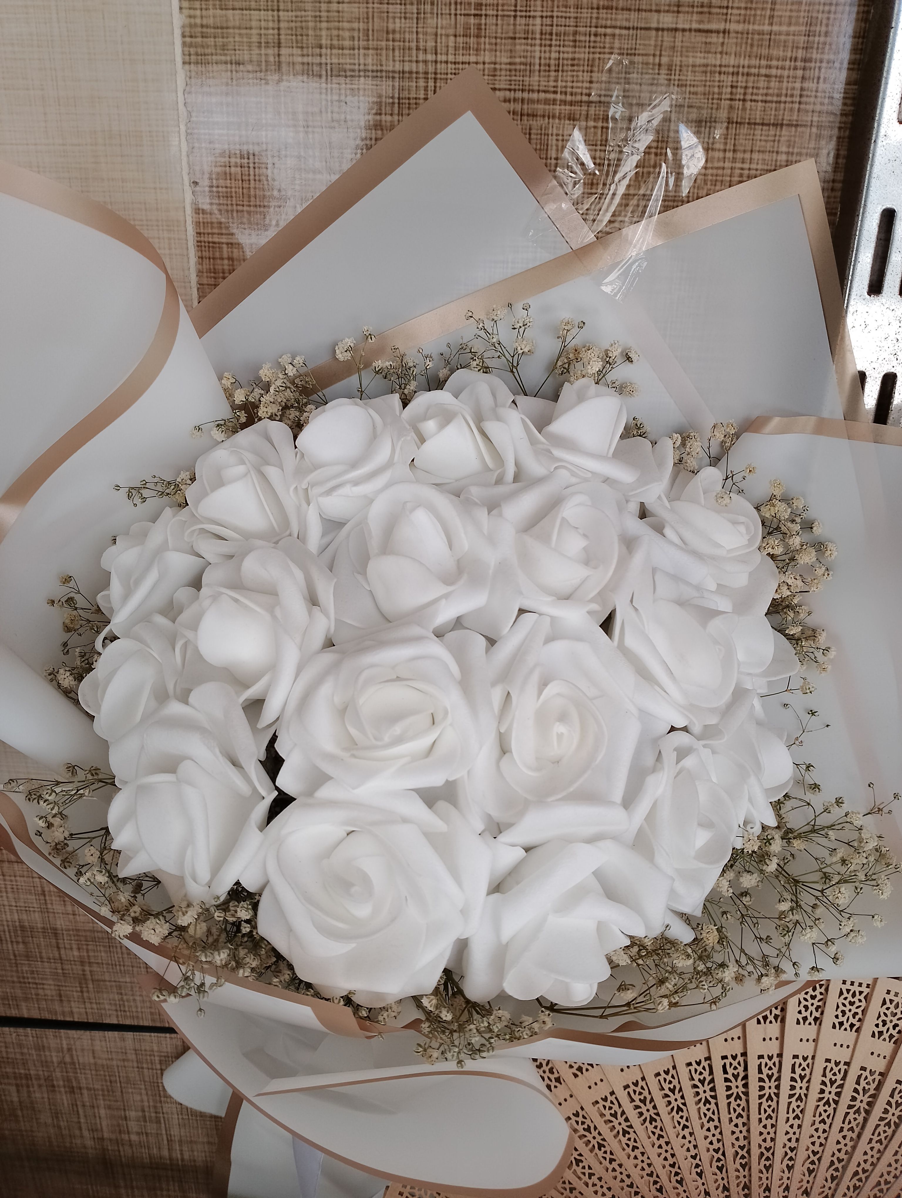 Elegant White Rose Bouquet in Decorative Wrapping · Free Stock Photo