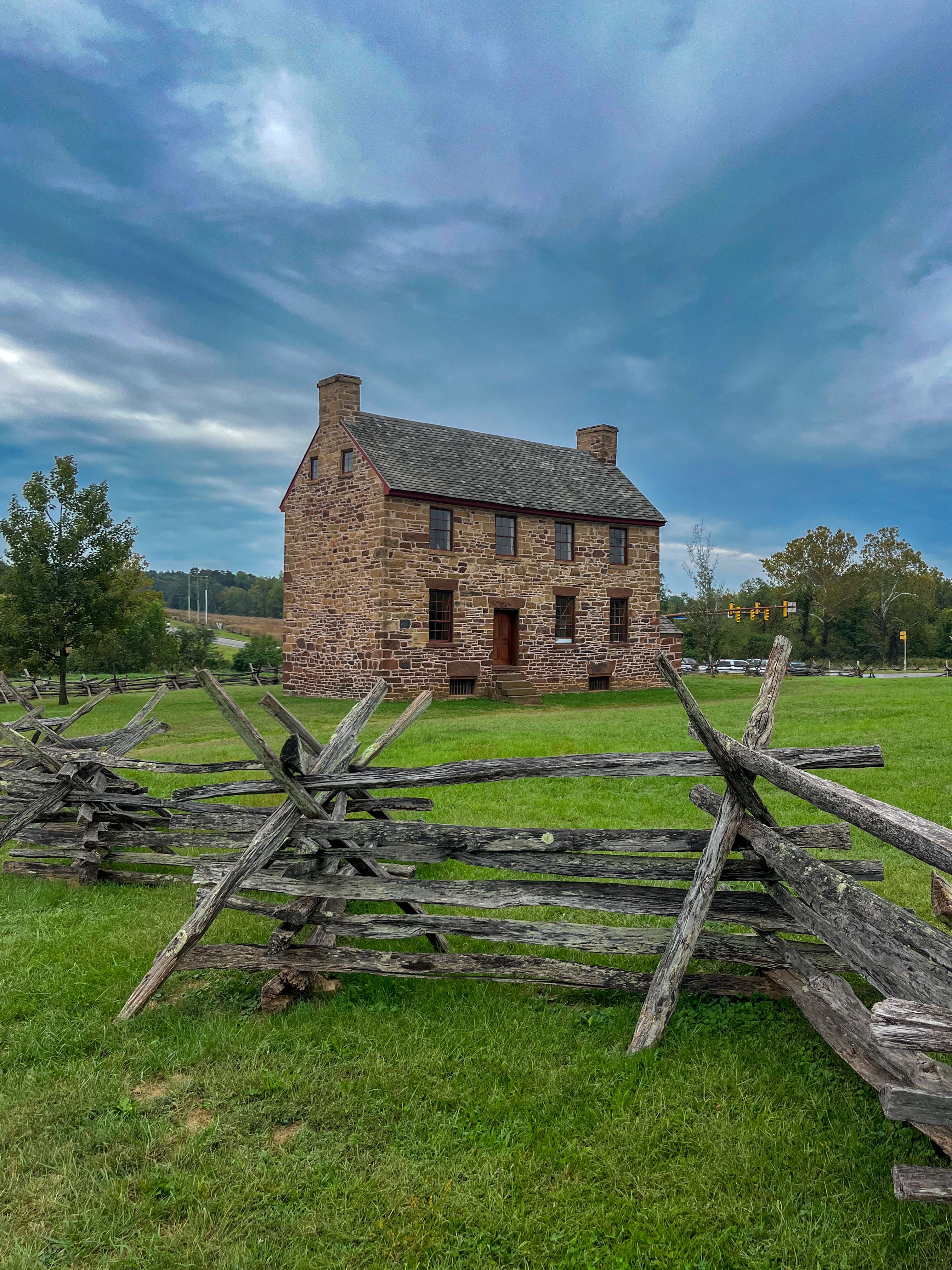 Historic Stone House with Wooden Fence in Countryside · Free Stock Photo