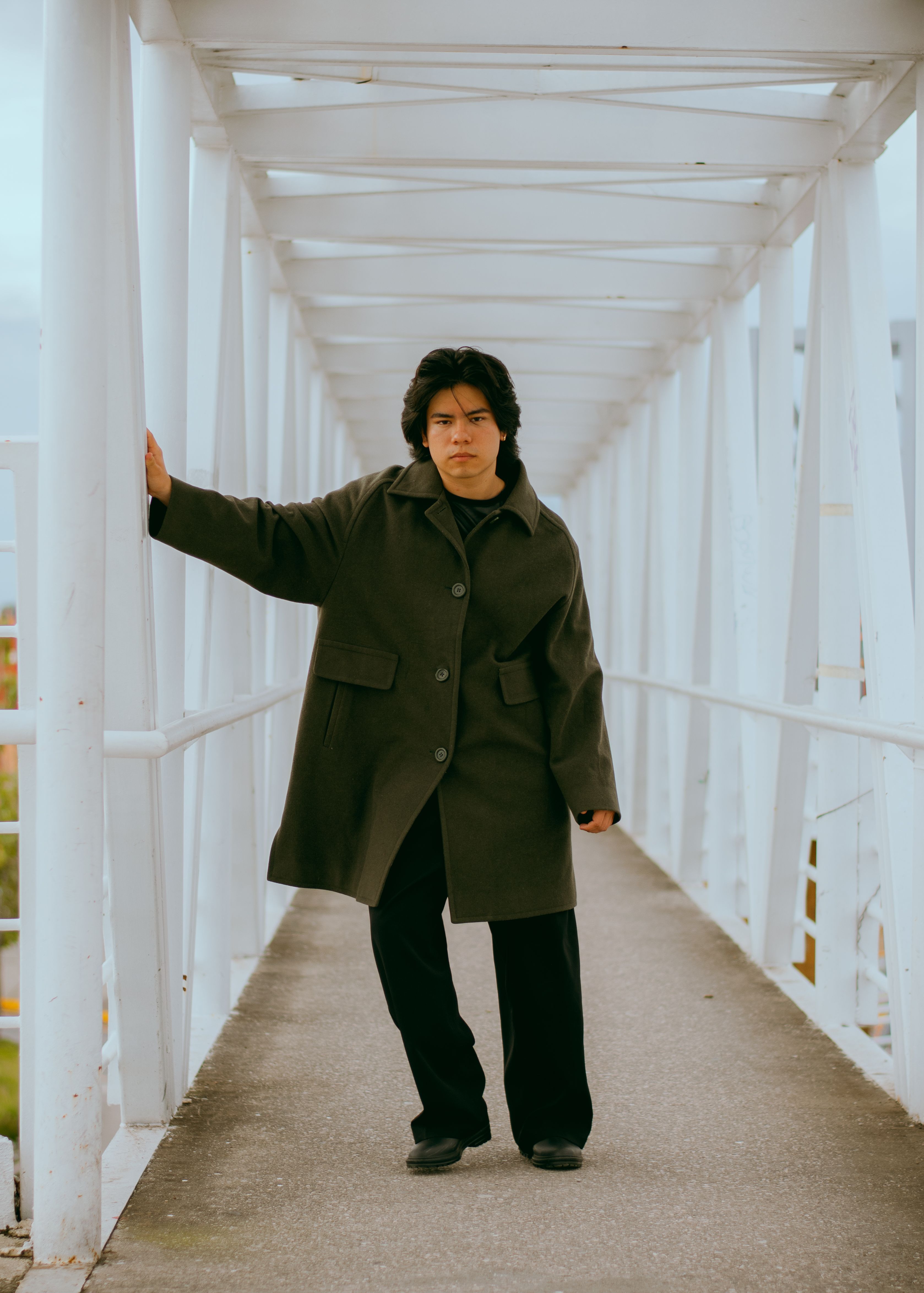 Stylish Man Posing on Modern Outdoor Bridge · Free Stock Photo