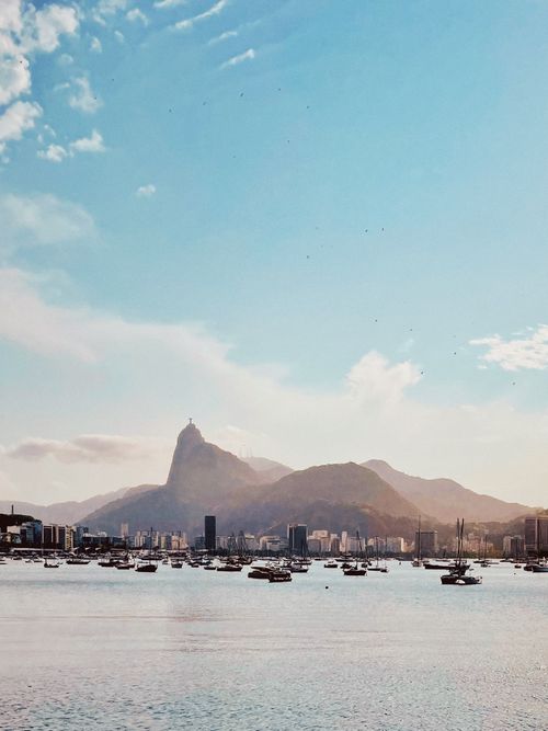 Free Stunning view of Sugarloaf Mountain with sailboats in Rio de Janeiro's harbor under a bright sky. Stock Photo