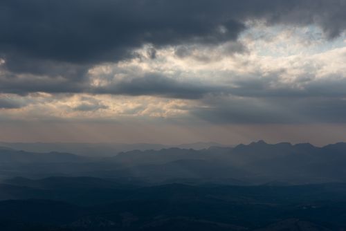 Free A moody cloudscape view over mountainous terrain in Minas Gerais, Brazil during twilight. Stock Photo