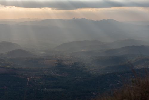 Free Sunlit mountains with dramatic clouds in Minas Gerais, Brazil. Stock Photo
