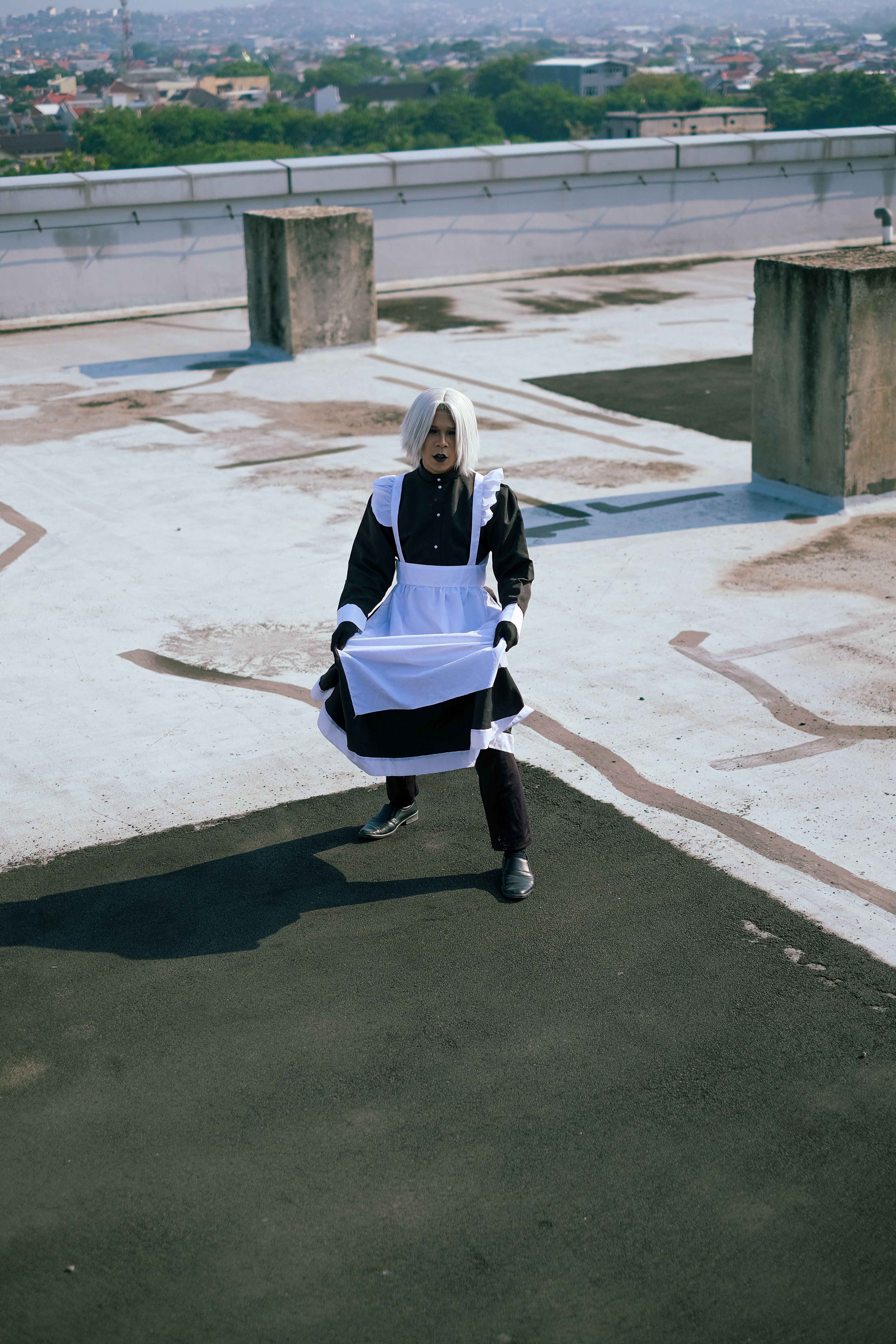 Cosplayer in Maid Outfit on Rooftop Terrace · Free Stock Photo