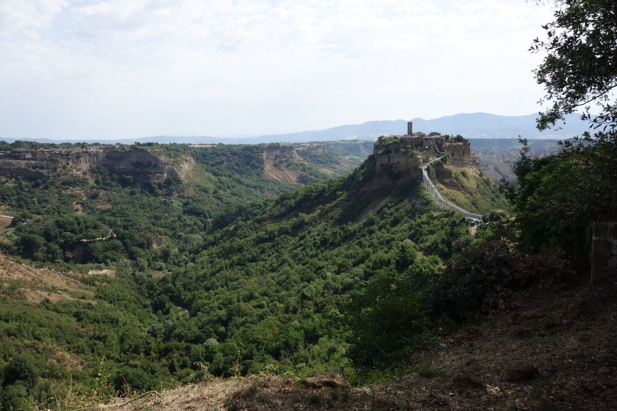 Civita di Bagnoregio — a medieval town on a crumbling tufa butte, reachable only by footbridge.