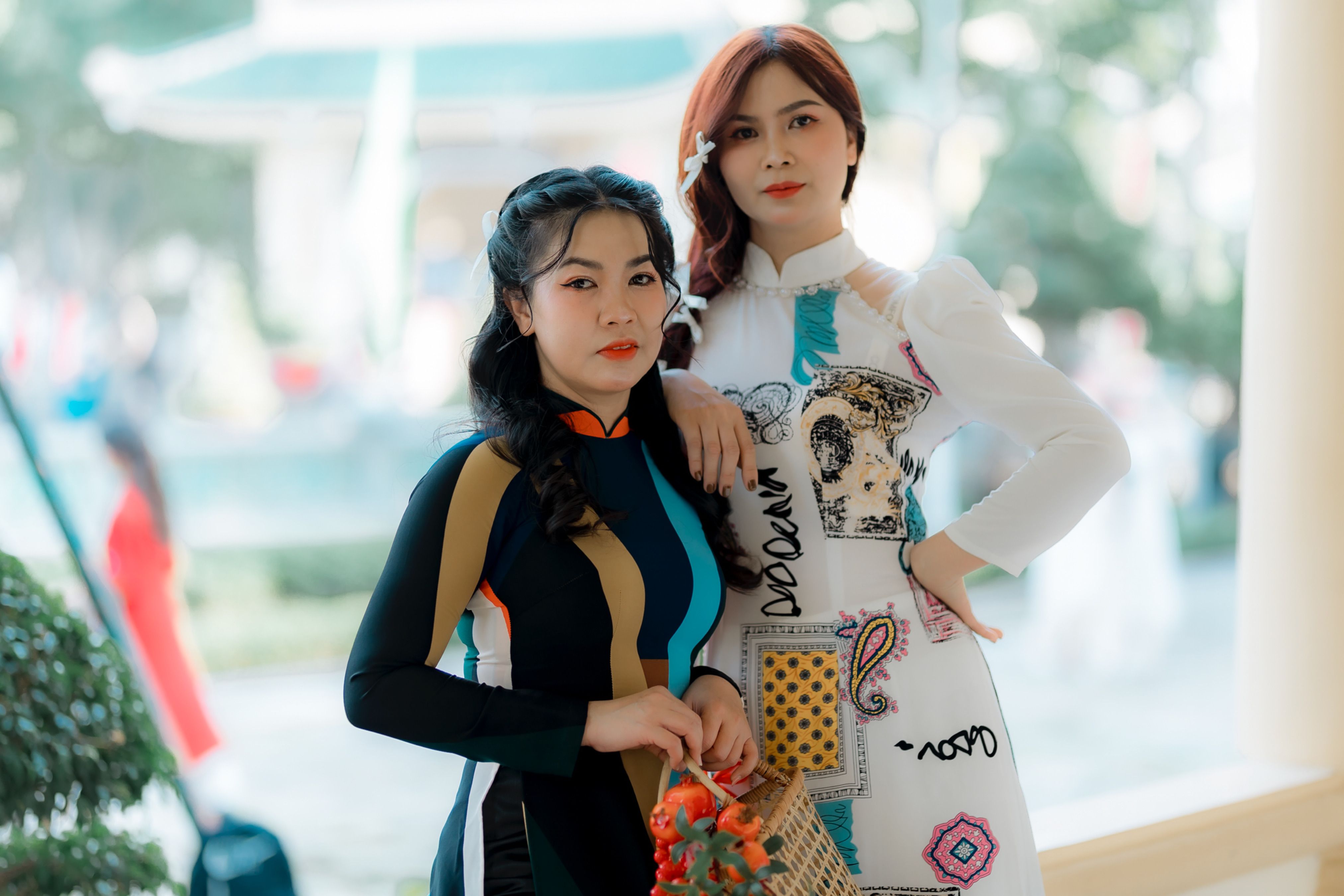Two Women in Colorful Traditional Dresses Outdoors · Free Stock Photo