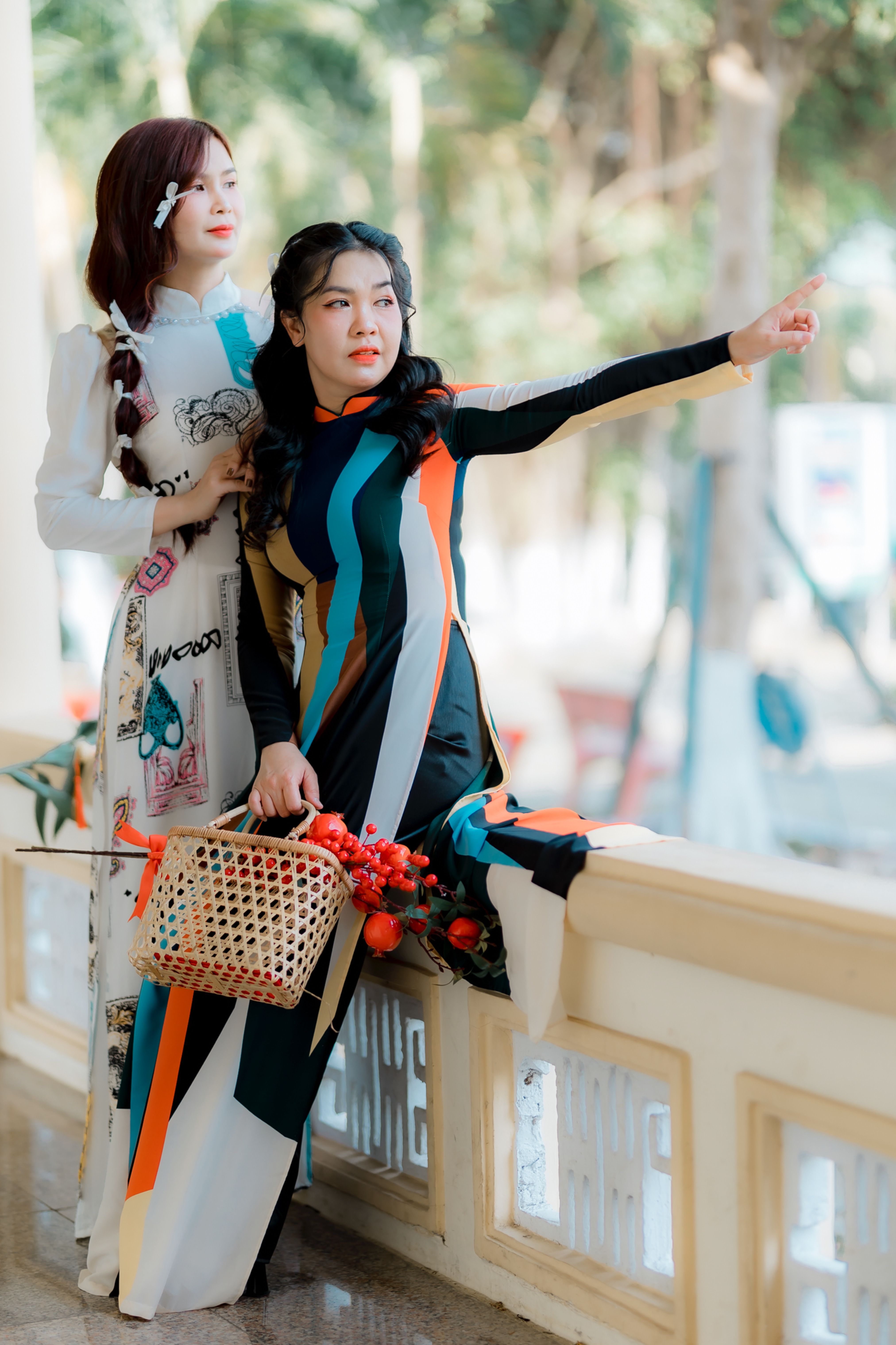 Two Women in Colorful Traditional Dresses Outdoors · Free Stock Photo