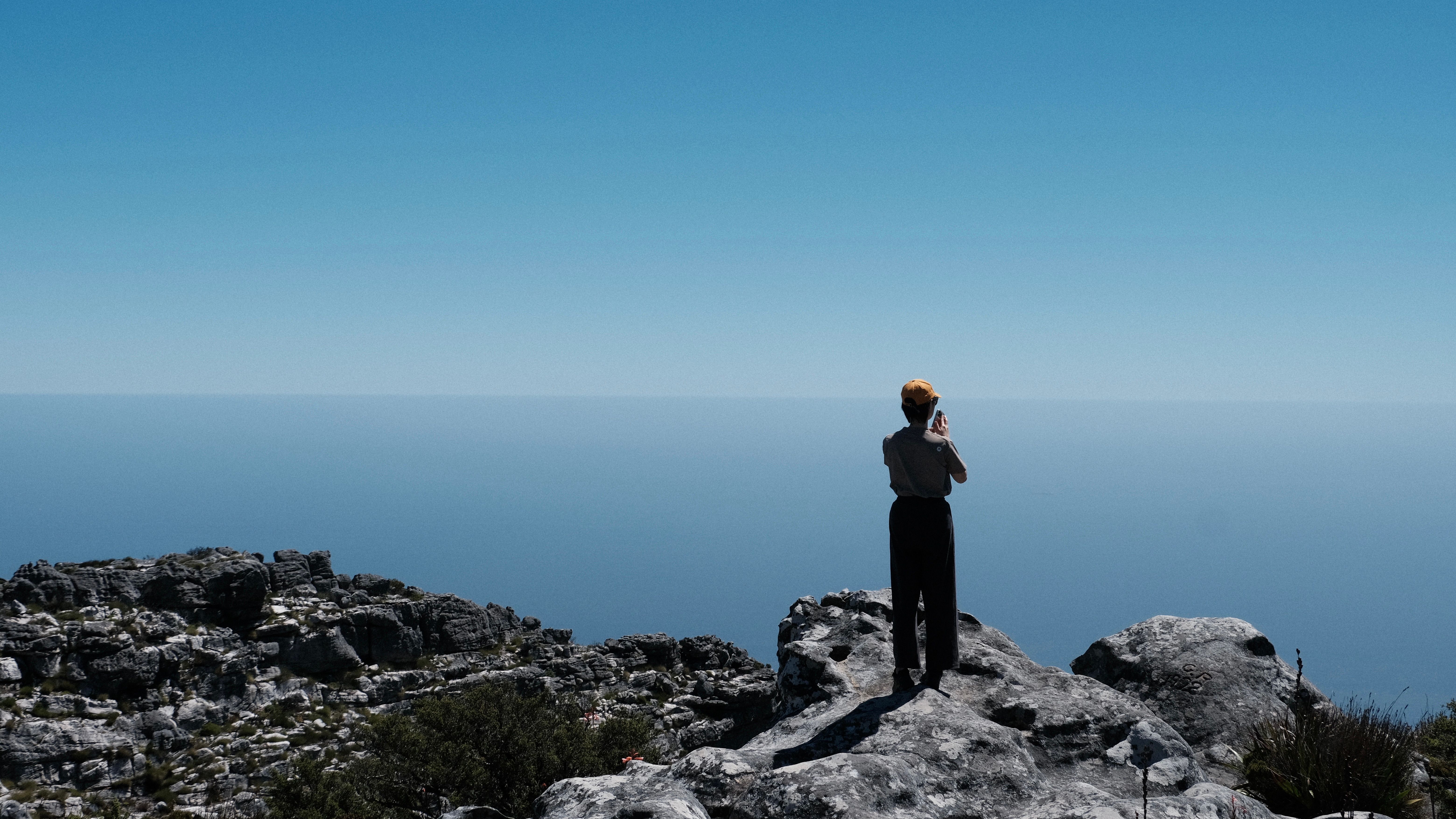 Hikers on a mountain path above the Atlantic seaboard