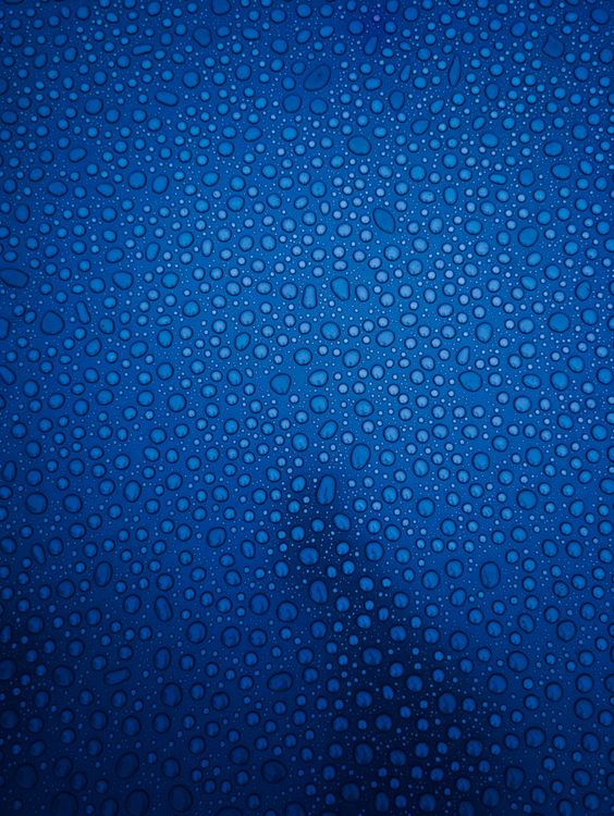 Blue Water Droplets on Glass Surface · Free Stock Photo