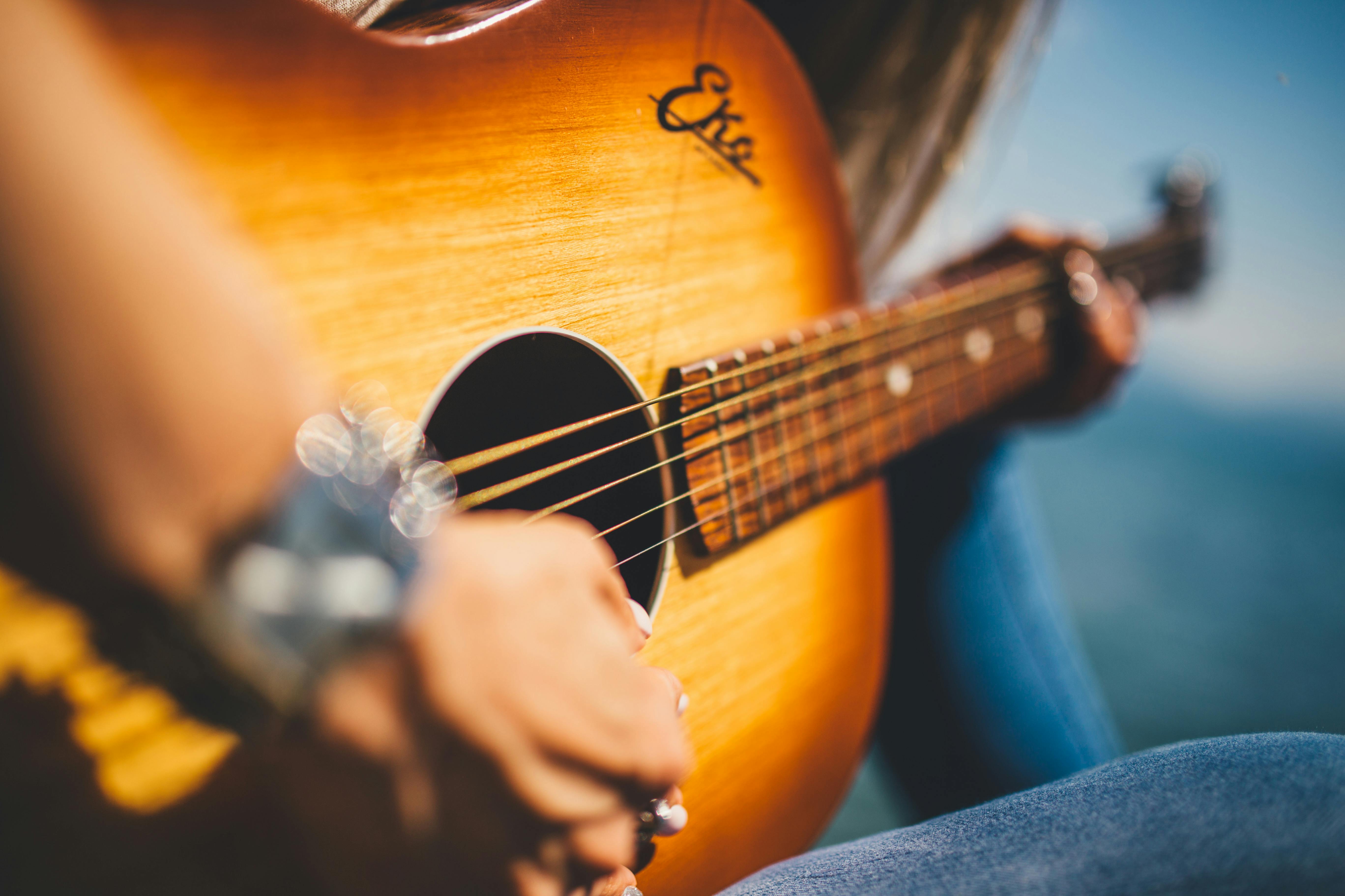 Person Play Guitar In Close Up Photo Free Stock Photo