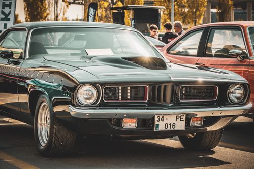 Free A vintage muscle car displayed outdoors at a car show in Ankara, Türkiye. Stock Photo