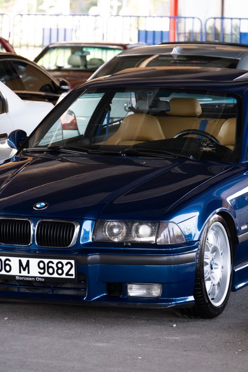 Free A stylish blue vehicle with leather interior on display in Ankara, highlighting its sleek design and shiny finish. Stock Photo