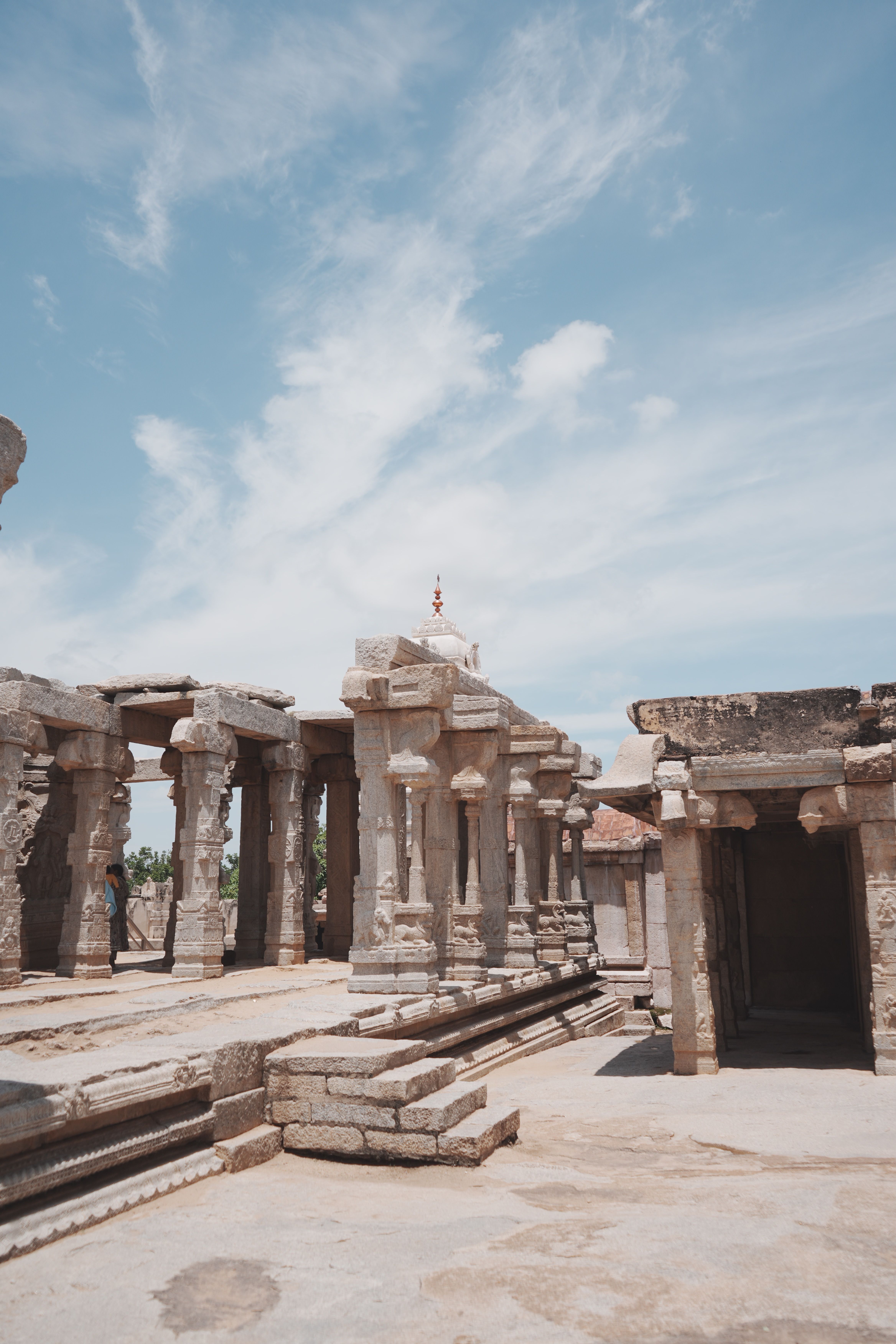 Ancient Stone Temple Ruins Under Blue Sky · Free Stock Photo