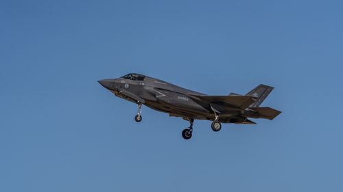 Free F-35 fighter jet flying against a clear blue sky at Los Llanos, Castilla-La Mancha, Spain. Stock Photo