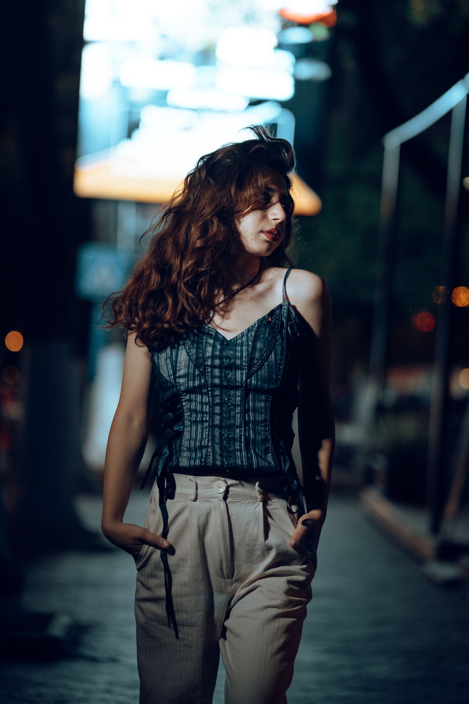 Woman in corset top at night