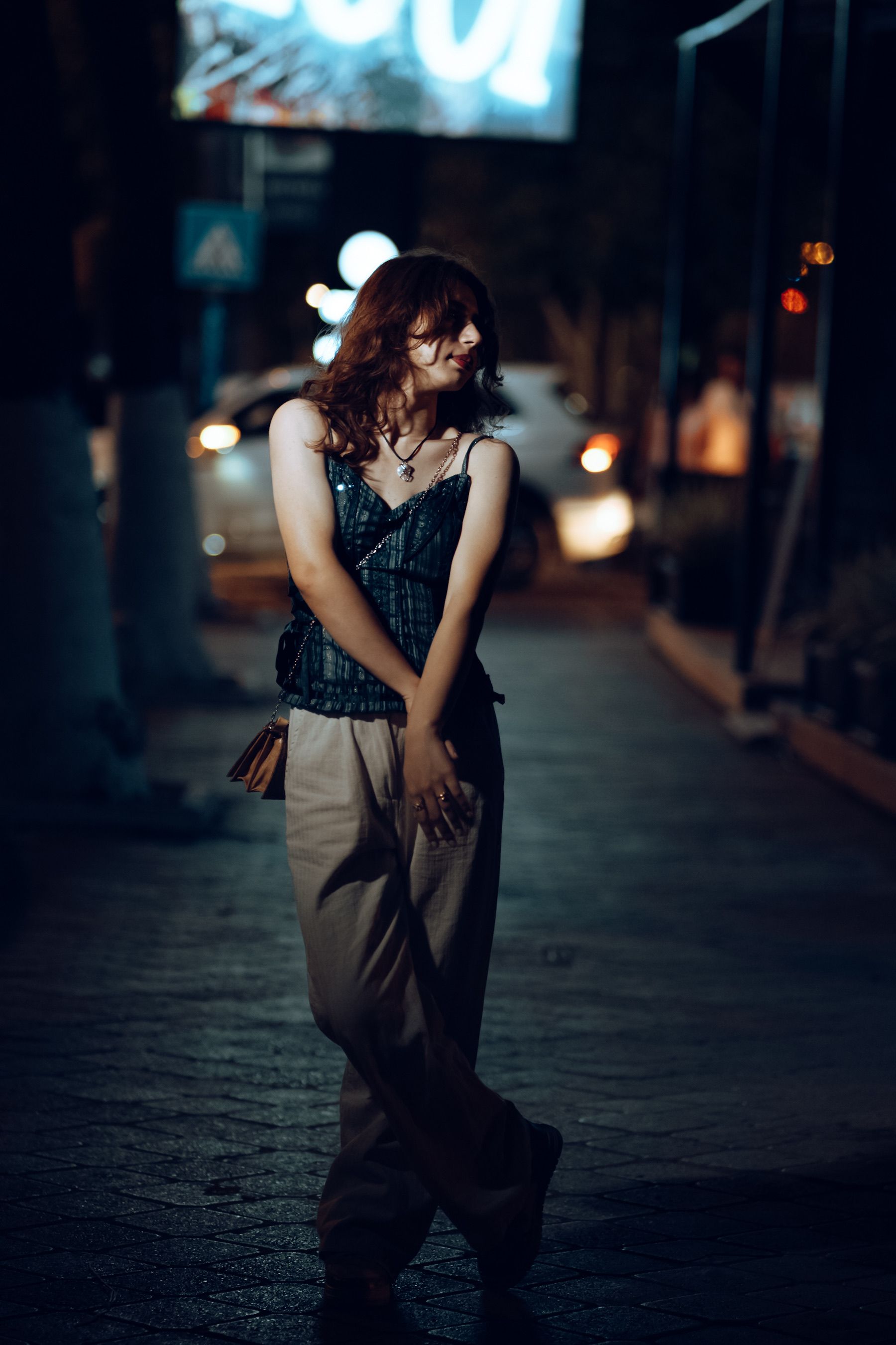 Young Woman Posing on Night City Street · Free Stock Photo