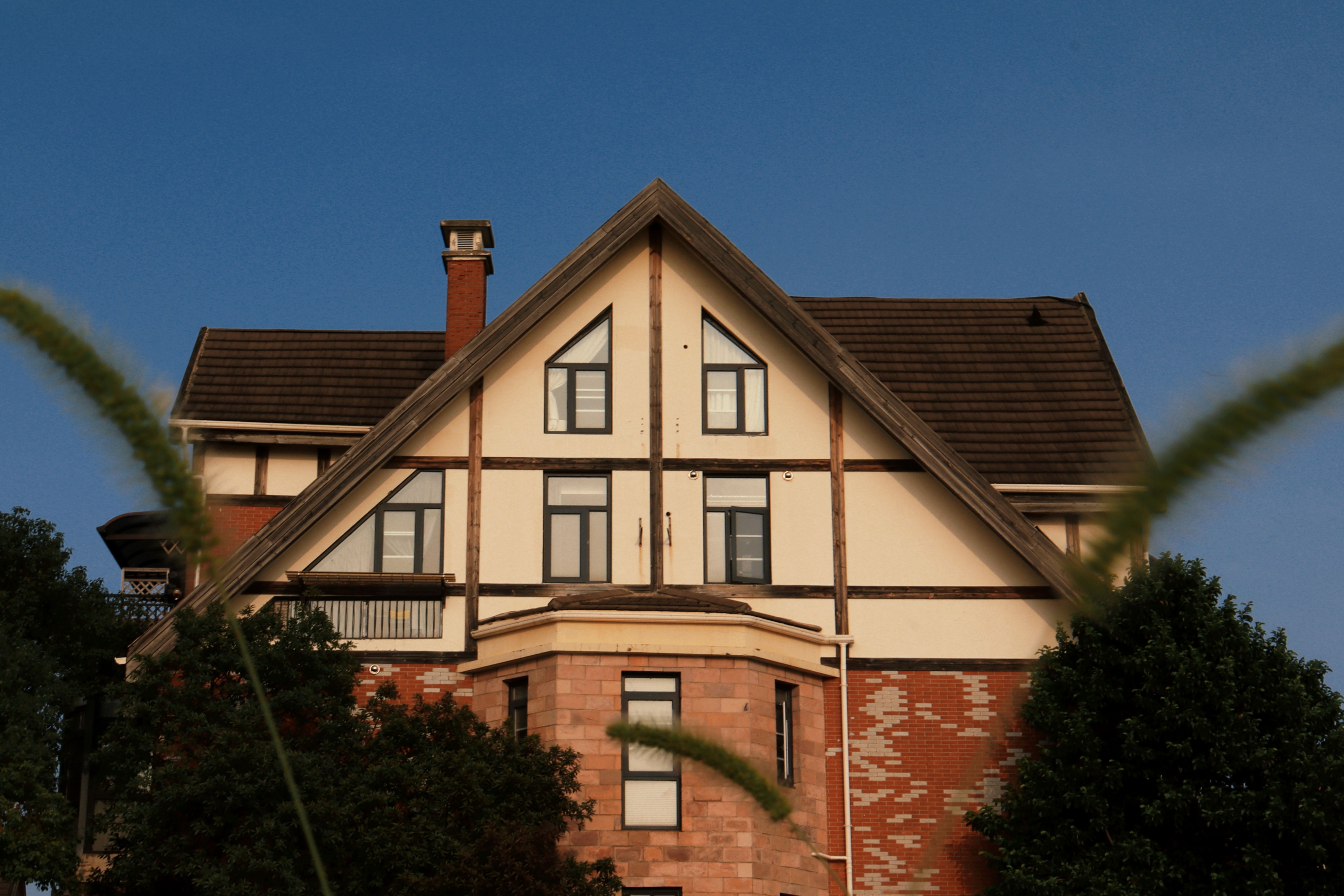 Charming Tudor-style house exterior with gable roof
