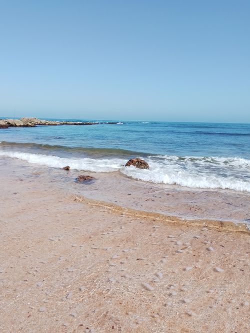 Free Discover the tranquility of Casablanca's coastline with crystal clear waters and blissful skies. Stock Photo