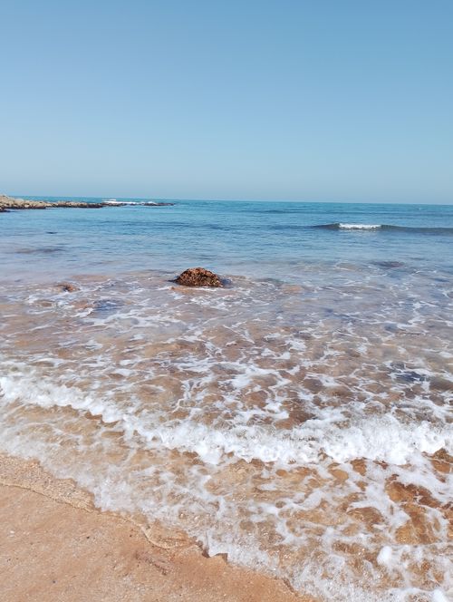 Free Vibrant and clear view of ocean waves crashing on Casablanca beach under a blue sky. Stock Photo