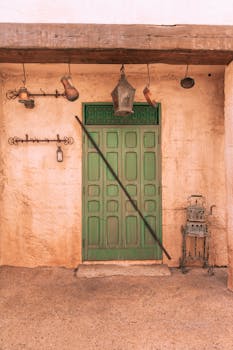 Rustic scene of a green door with vintage lanterns in Epcot, Florida.
