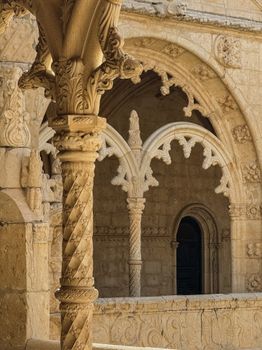 Beautifully detailed stone arches in historical architecture with ornate carvings.