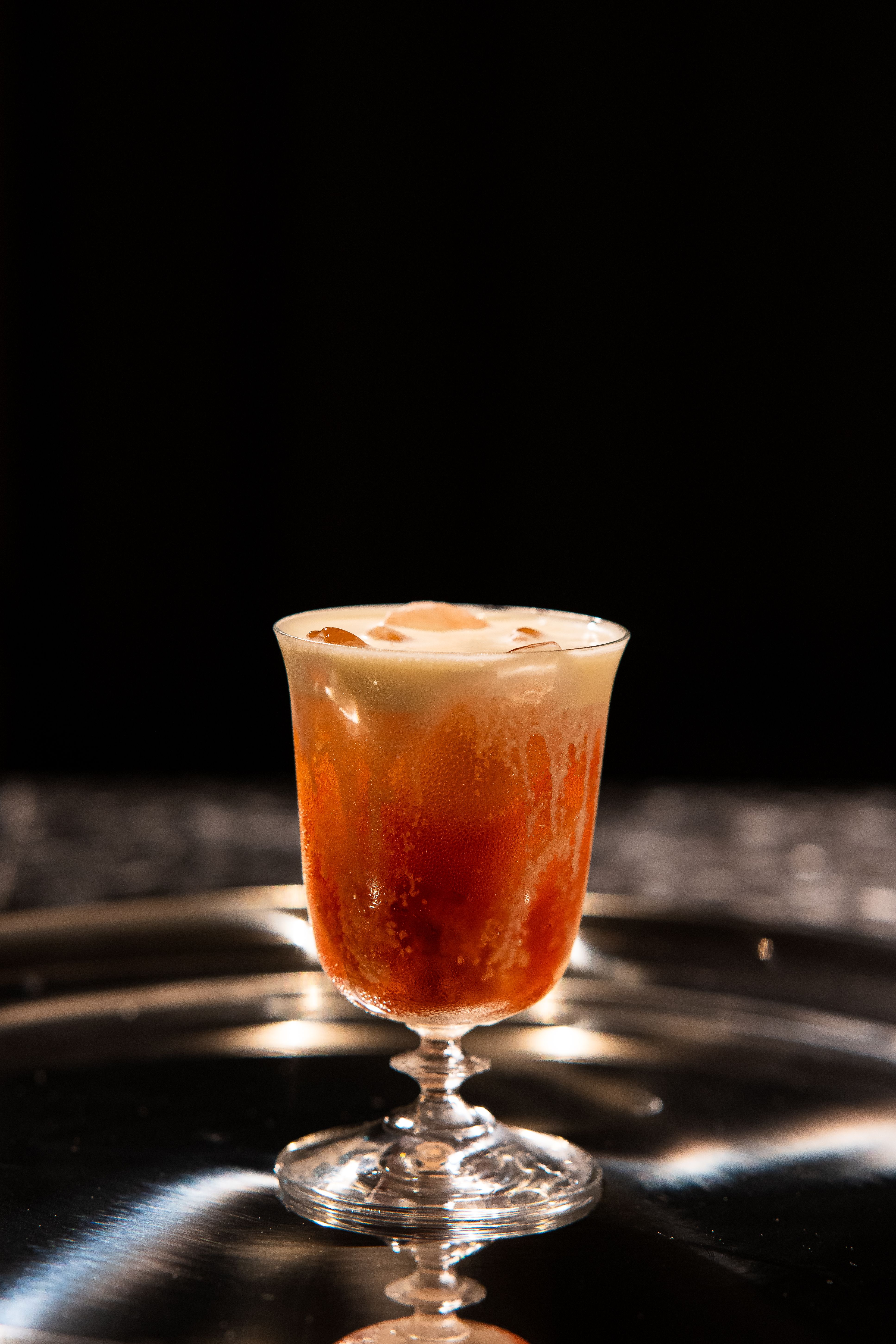 Elegant Cocktail Glass with Frothy Drink · Free Stock Photo