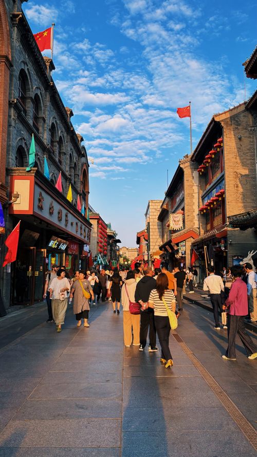 Free Bustling pedestrian street in Beijing, showcasing cultural architecture and vibrant life. Stock Photo