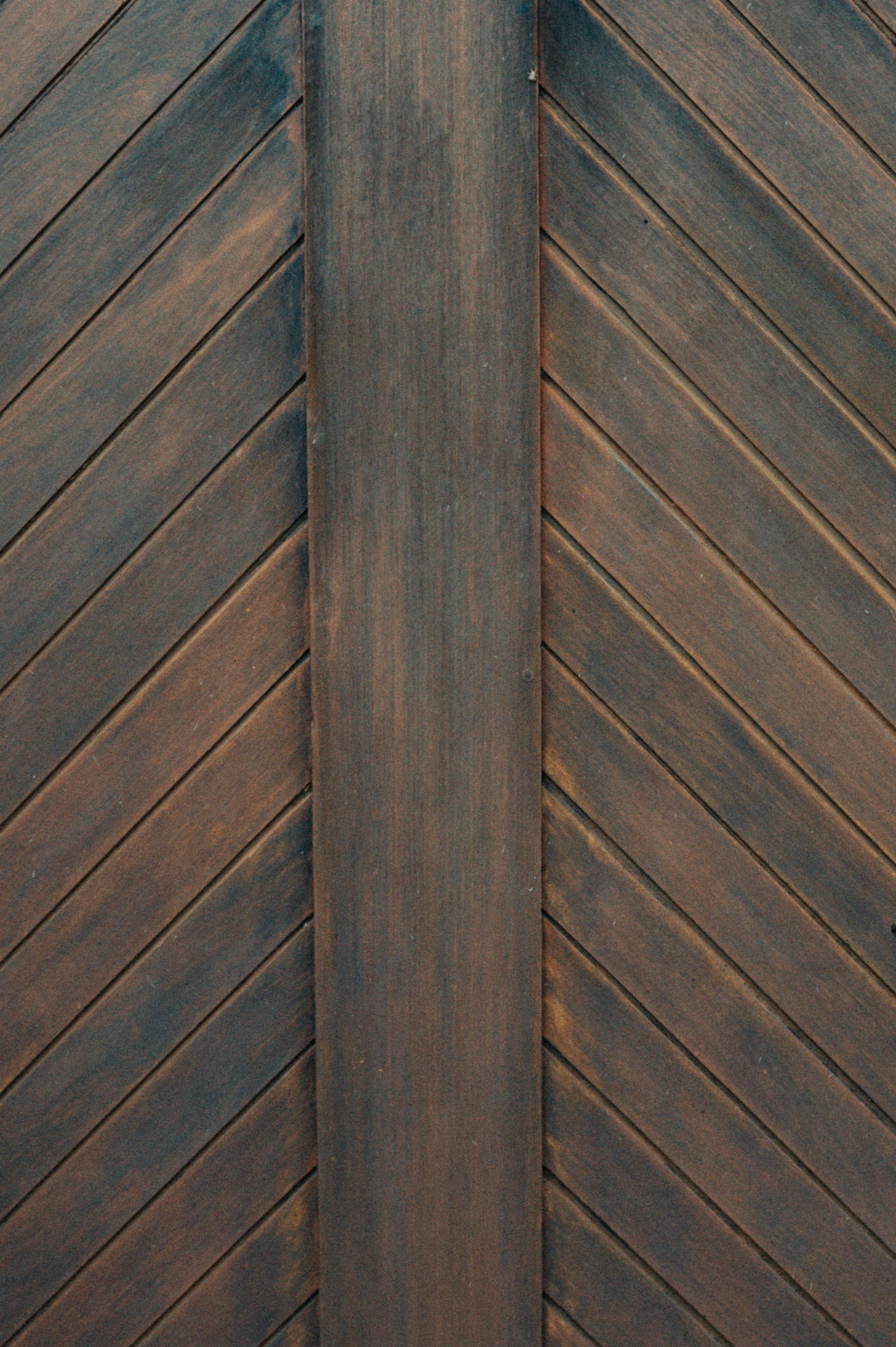 Free Detailed view of a rustic chevron wooden panel, showcasing its natural texture and pattern. Stock Photo