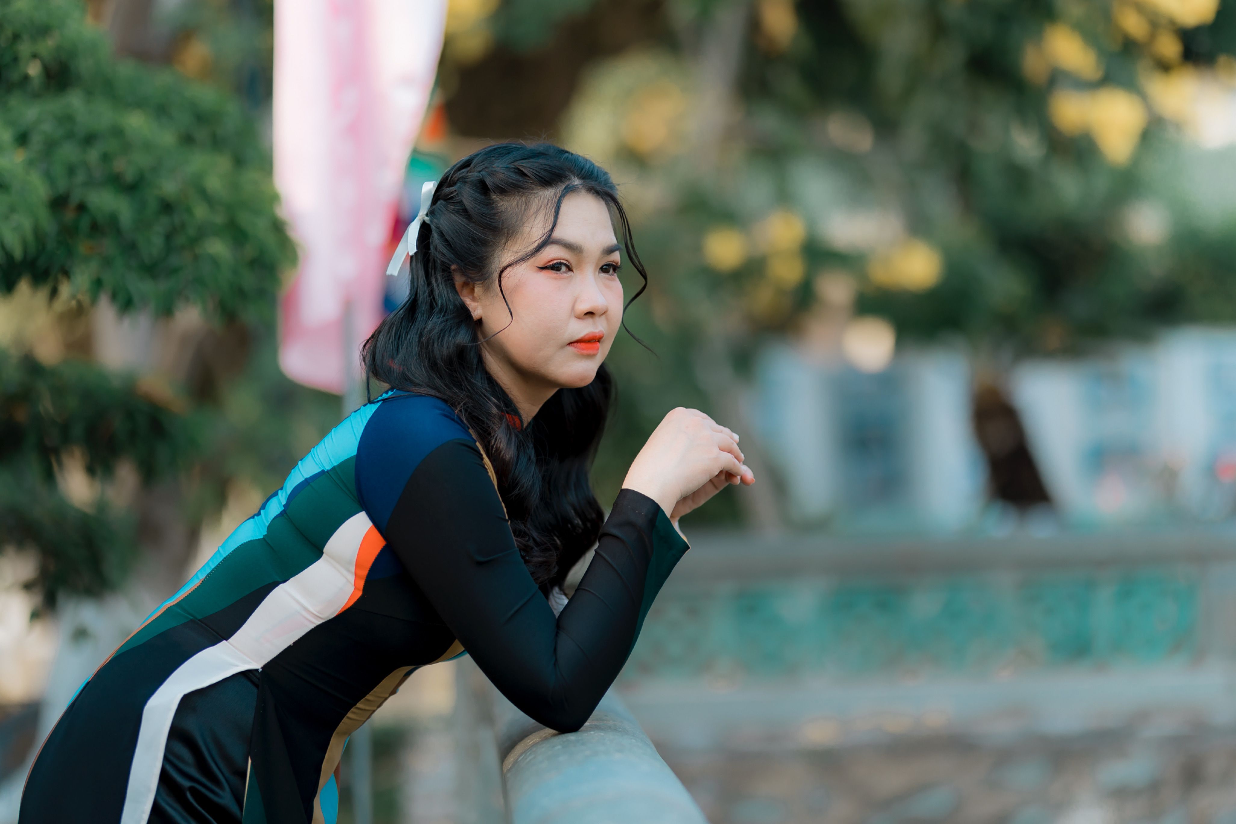 Woman Leaning on Railing Outdoors in Summer · Free Stock Photo