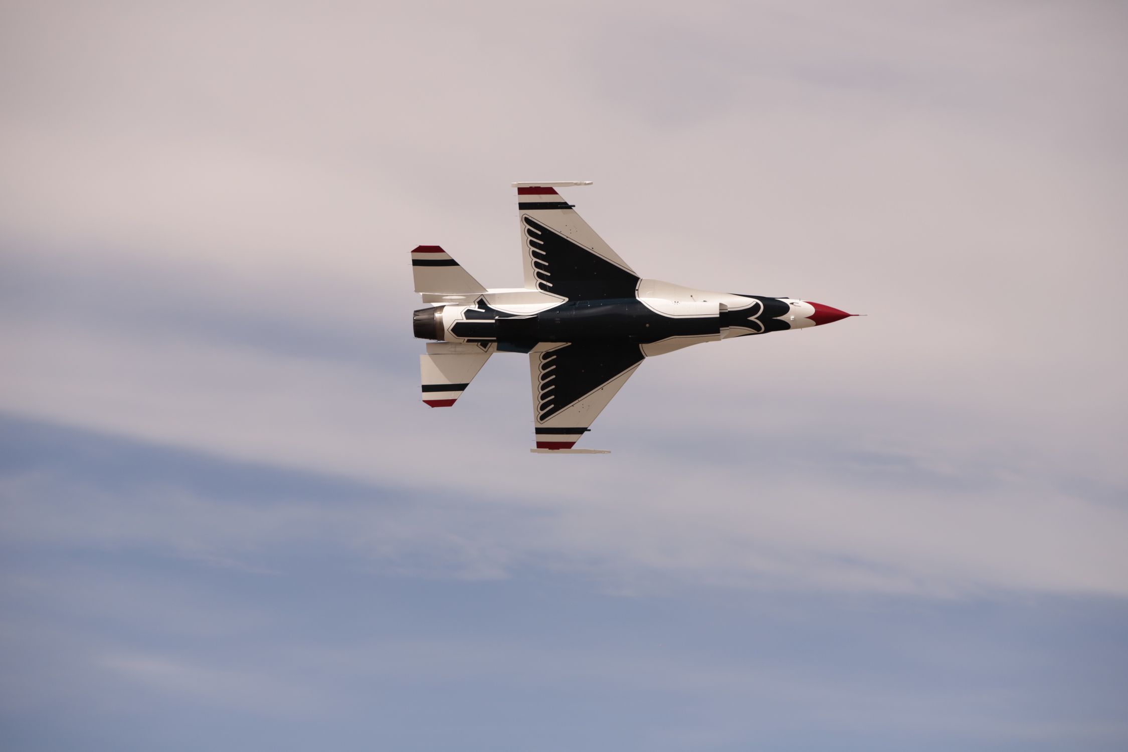 Aerobatic Jet Fighter Flying High in Clear Sky · Free Stock Photo