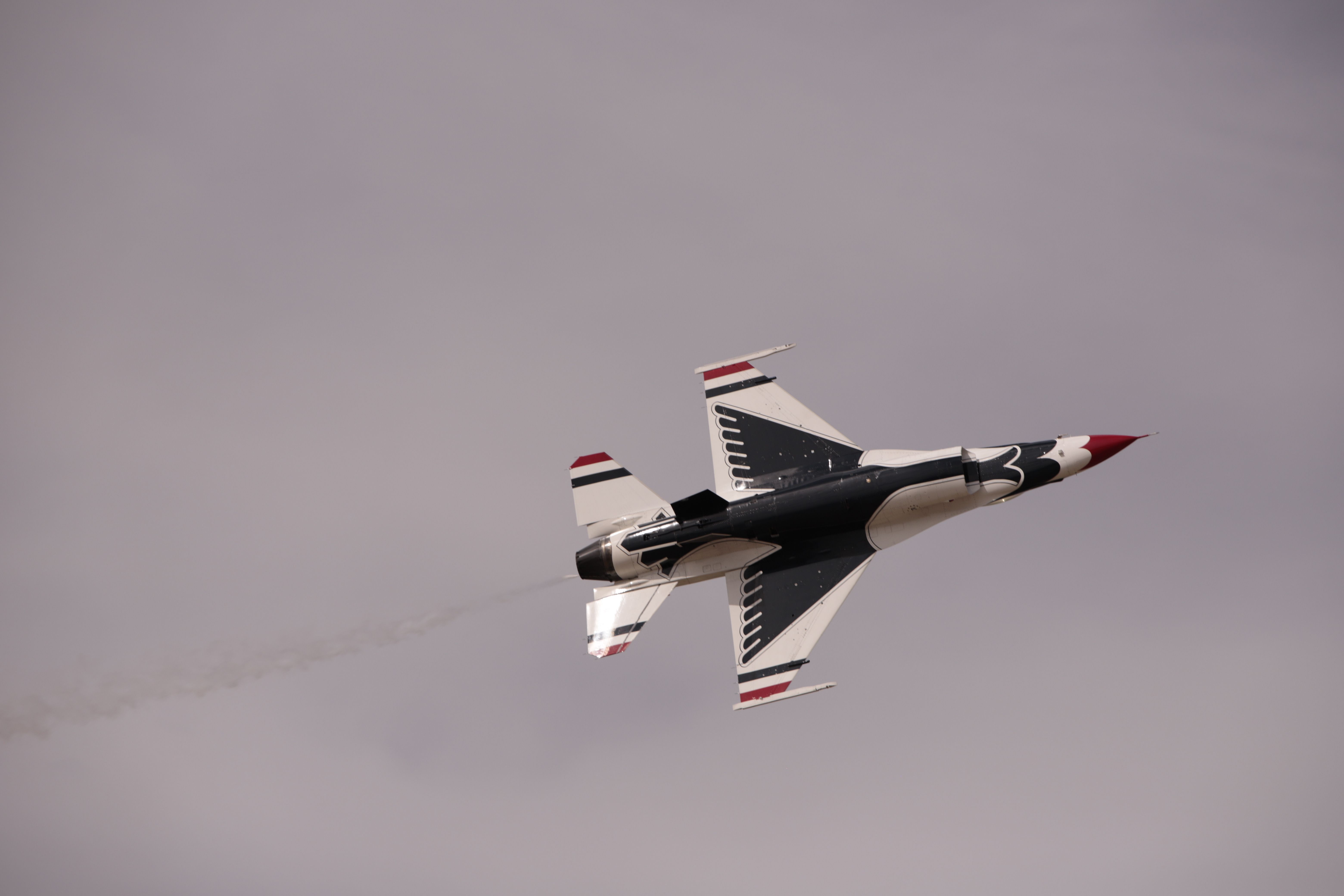 Dynamic Jet Fighter Performing in Overcast Sky · Free Stock Photo