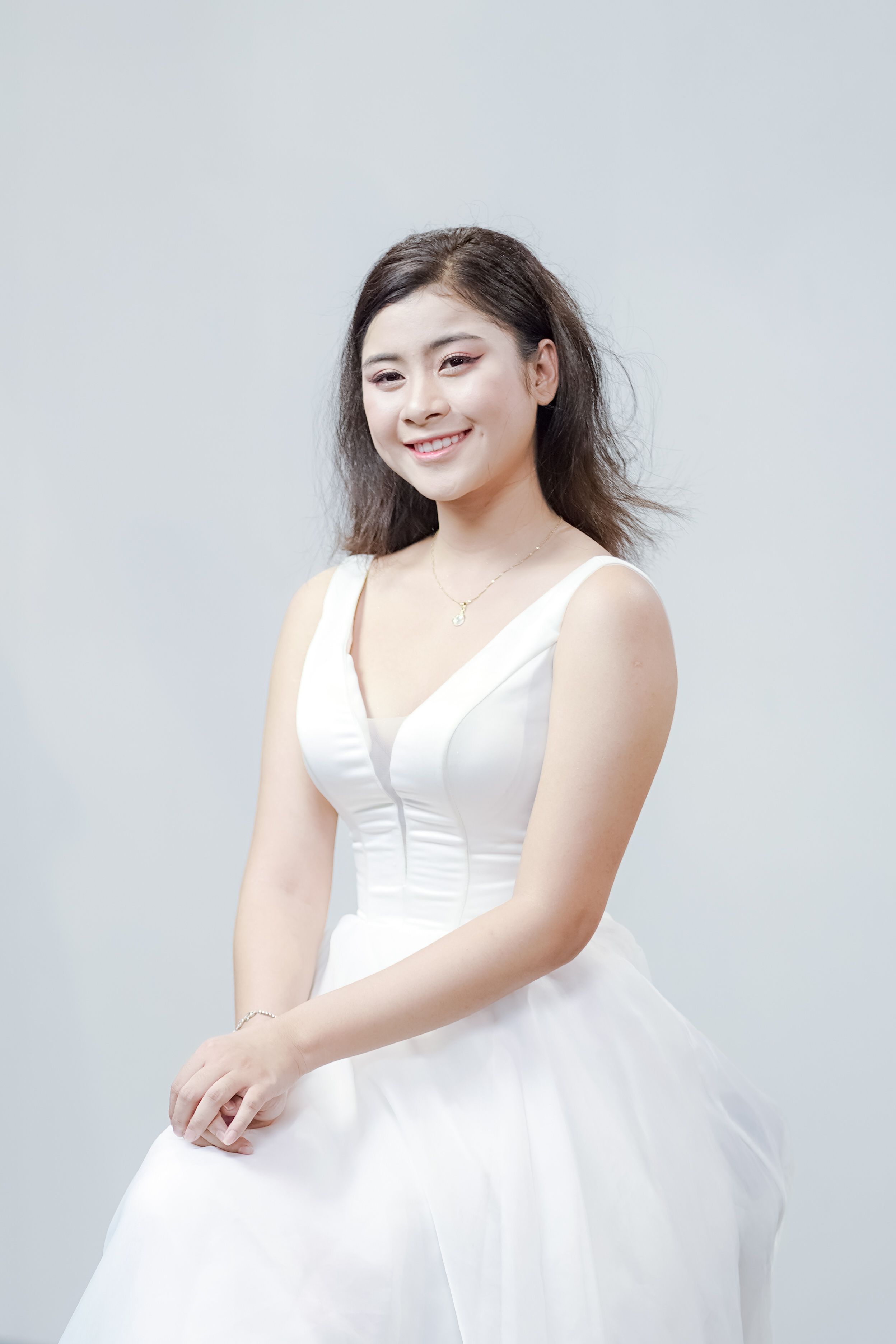 Elegant Portrait of a Woman in White Dress · Free Stock Photo