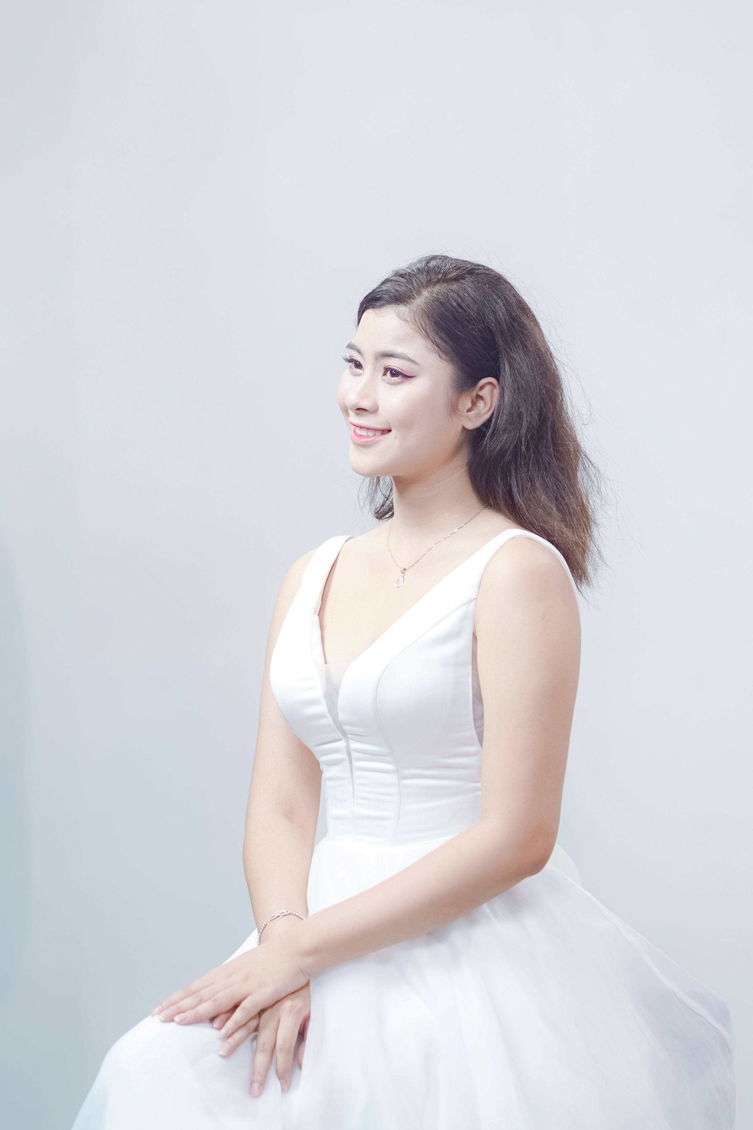 Elegant Portrait of Woman in White Dress · Free Stock Photo
