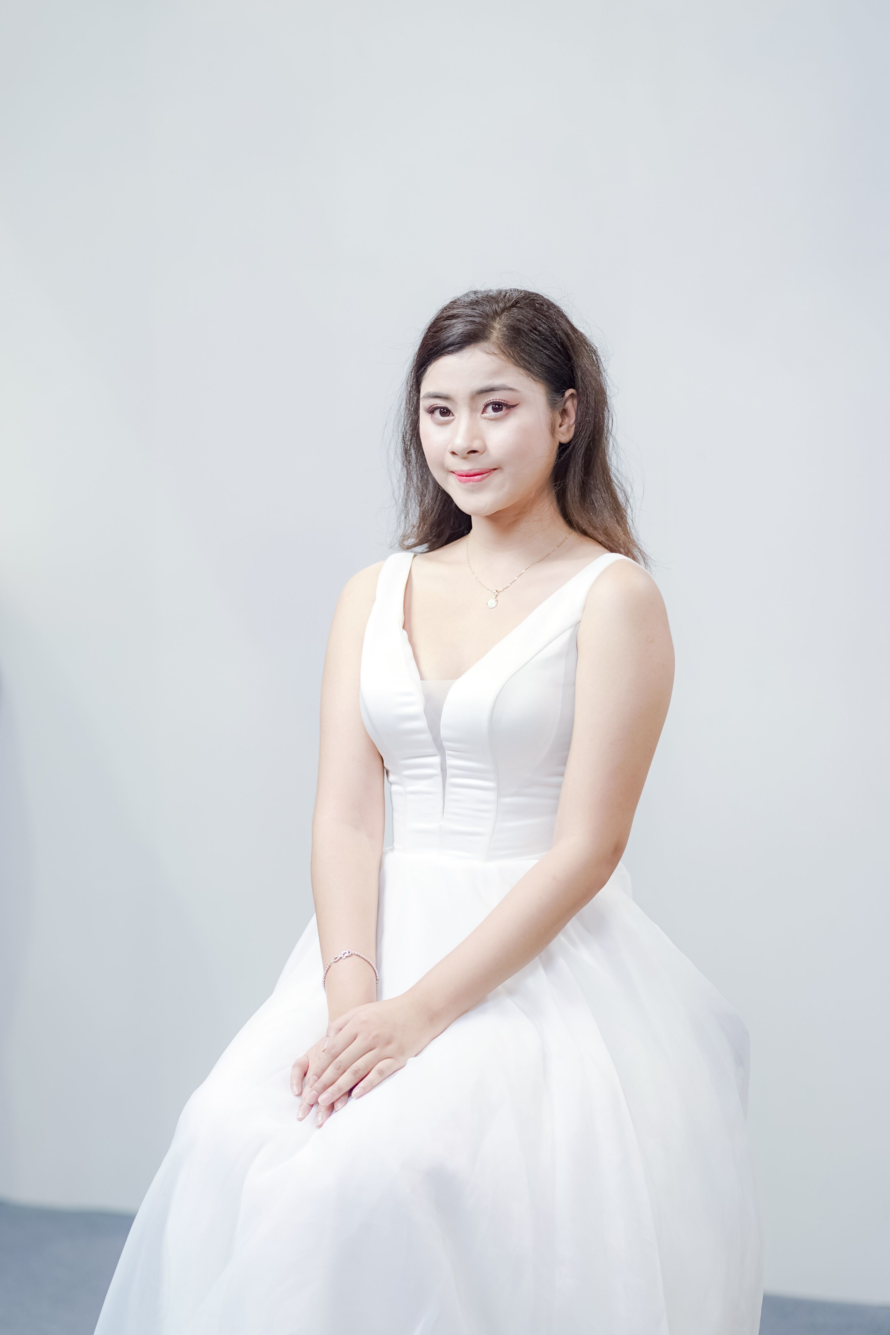 Elegant Portrait of a Woman in White Dress · Free Stock Photo