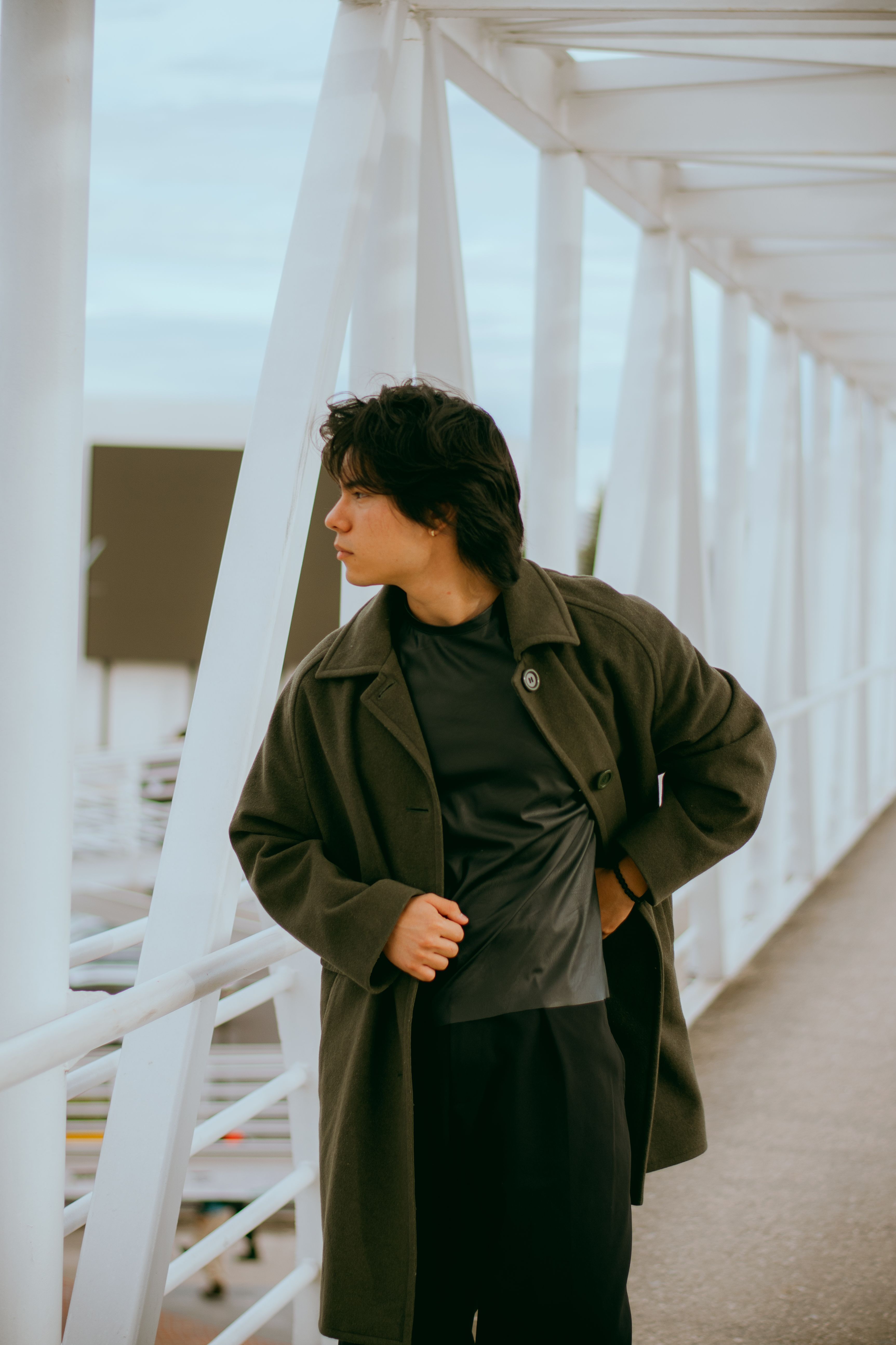 Stylish Young Man on a Modern Urban Bridge · Free Stock Photo