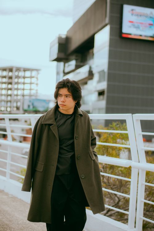 Free Stylish man in an urban setting showcasing outdoor fashion. Stock Photo