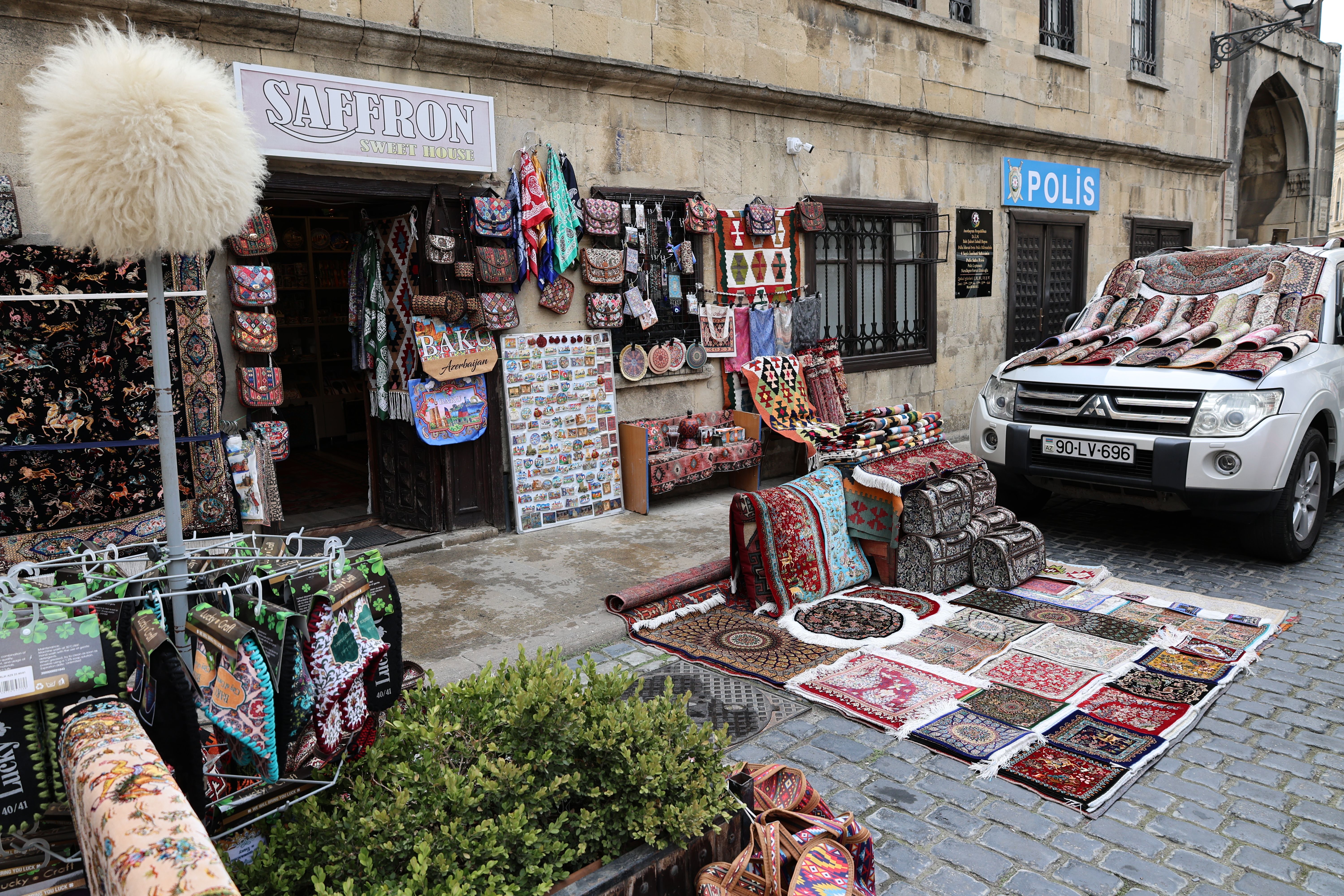 A bustling scene at Yaşıl Bazar (Green Market) in Baku, Azerbaijan, with fresh produce and spices
