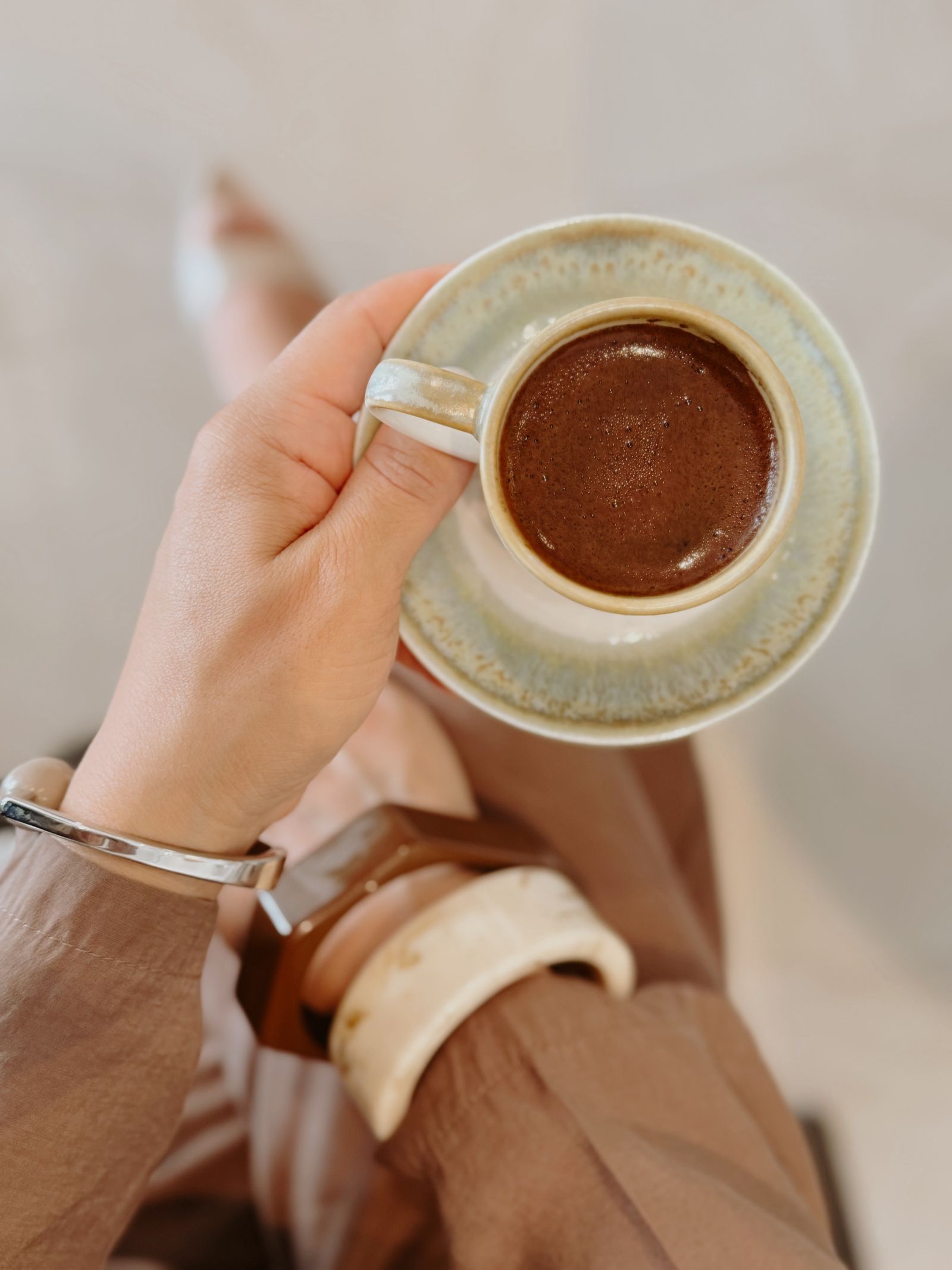 Peaceful everyday coffee ritual in warm neutral tones