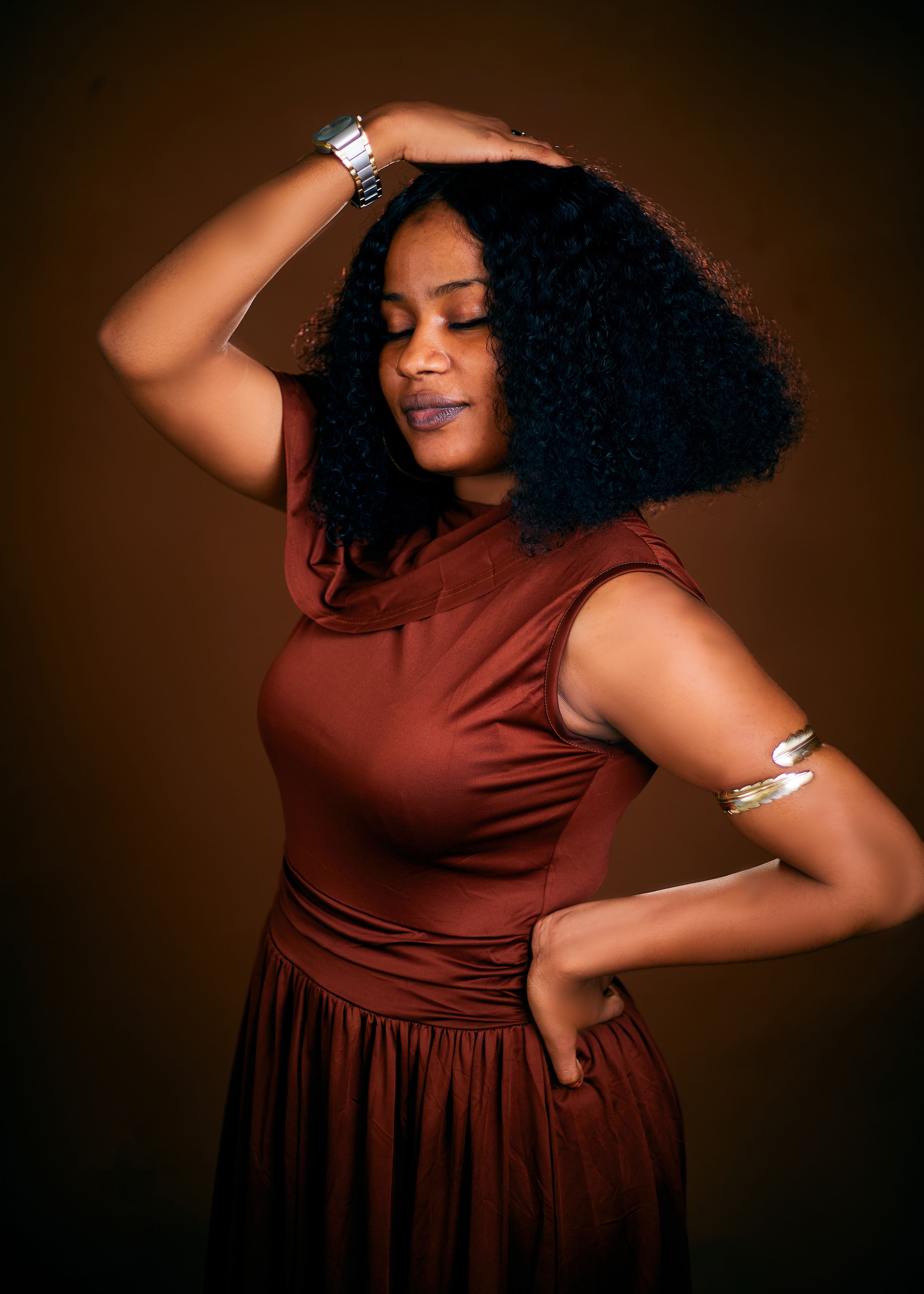 Elegant Portrait of a Woman in Brown Dress · Free Stock Photo