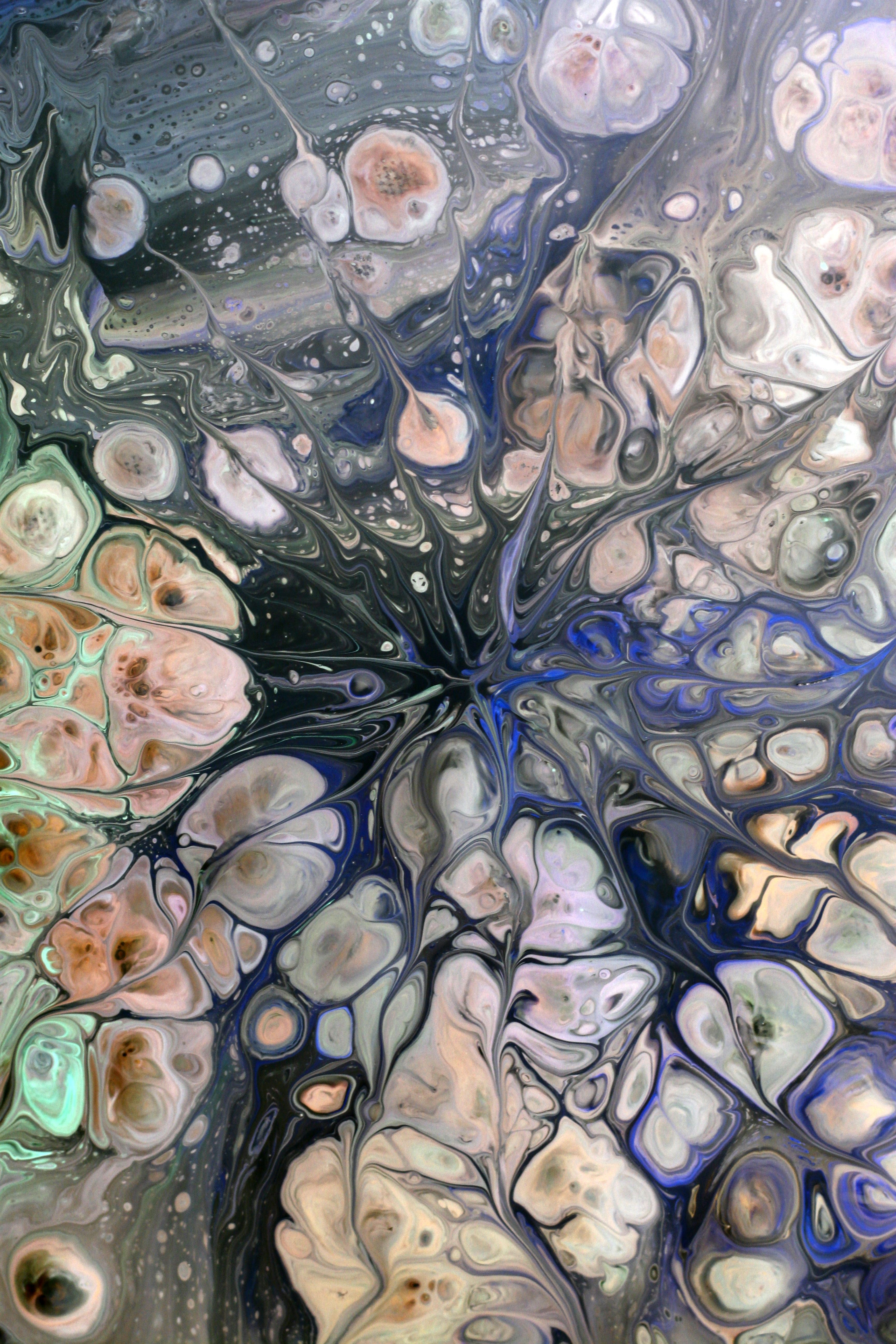 Colorful abstract fluid art resembling marble patterns.