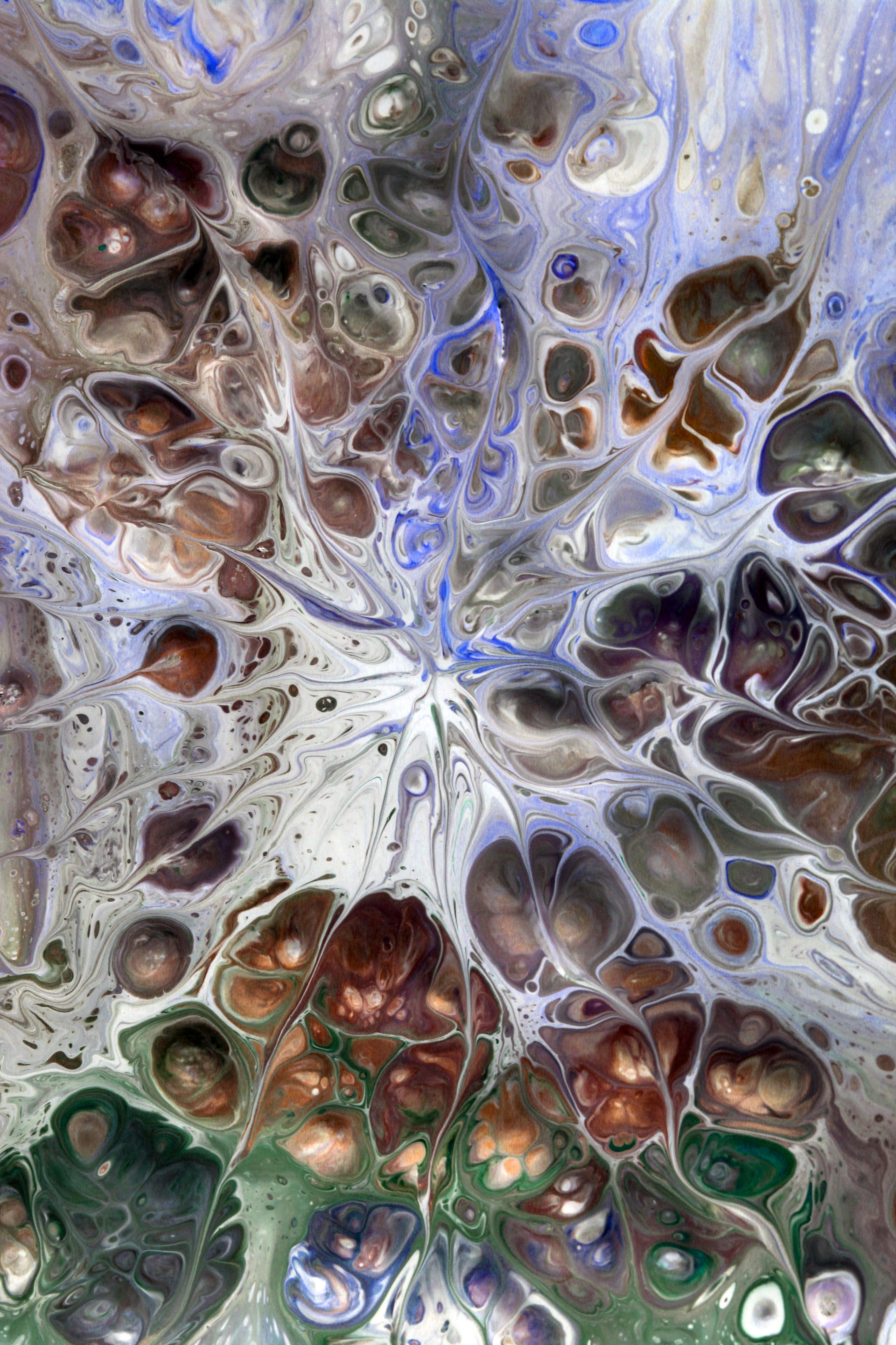 Captivating abstract fluid art with vibrant swirling patterns and colors.