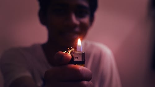 Man Holding Disposable Lighter