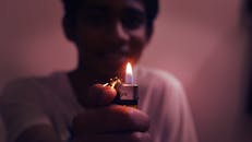 Man Holding Disposable Lighter