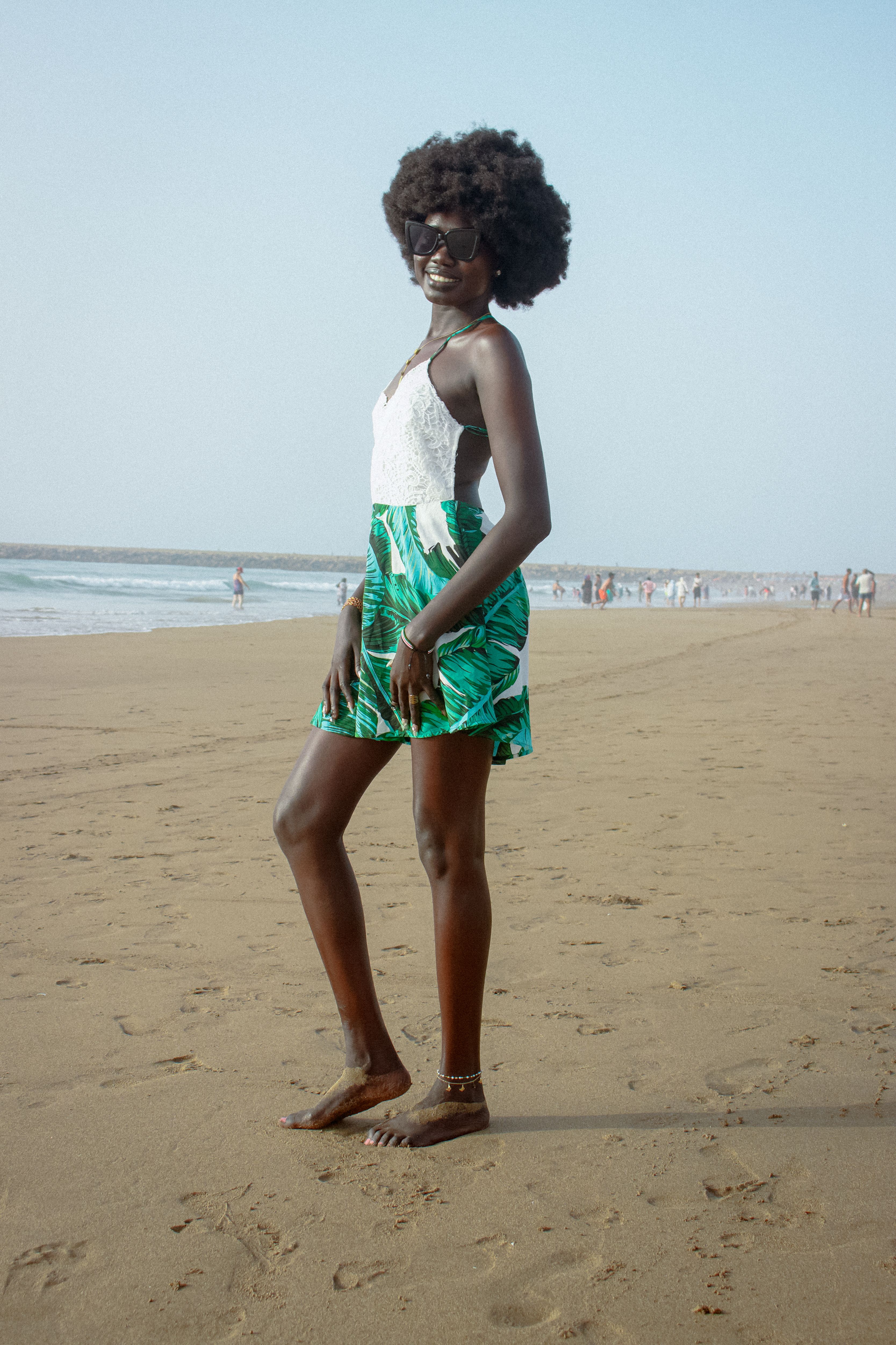 Elegant Woman Posing on a Sandy Beach · Free Stock Photo