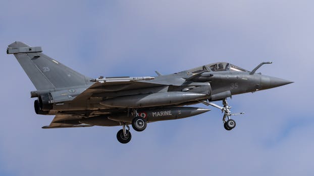 Dassault Rafale jet flying over Los Llanos, Spain, showcasing military aviation prowess.