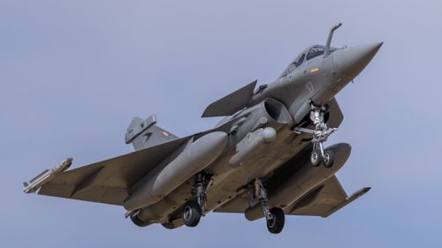 Free A Dassault Rafale fighter jet in flight, showcasing its delta wing design against a clear sky. Stock Photo