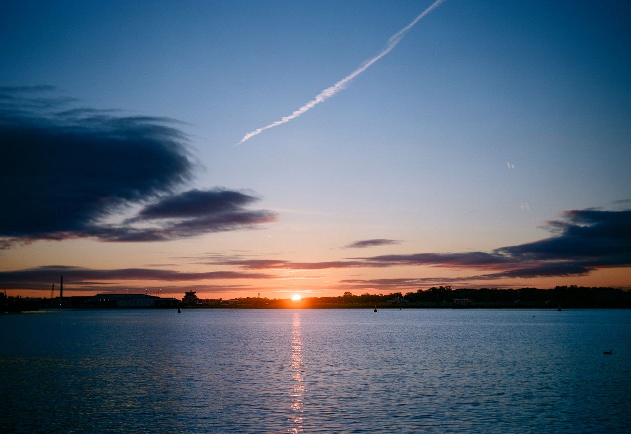 Stunning sunrise over calm ocean horizon
