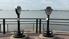 Scenic View of Binoculars over Waterfront