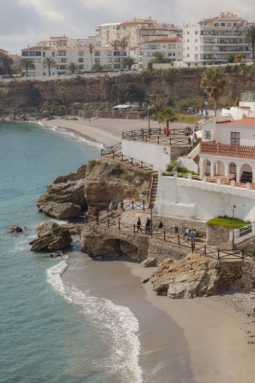 Free Explore a picturesque coastal walkway along the Mediterranean in a vibrant seaside town. Stock Photo